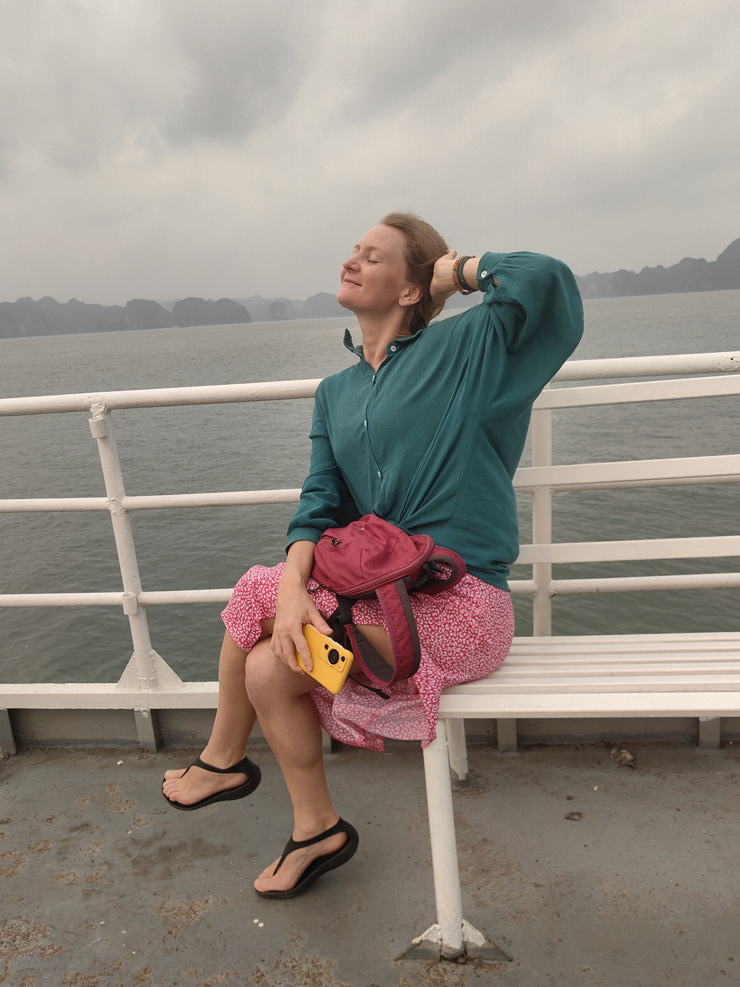 Ferry departs Tuan Chau Ward with passengers photographing scenic views