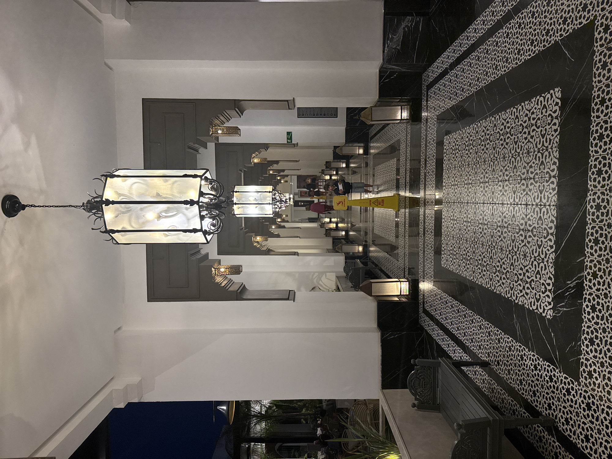 Interior corridor with white archways documented in Agadir, Morocco