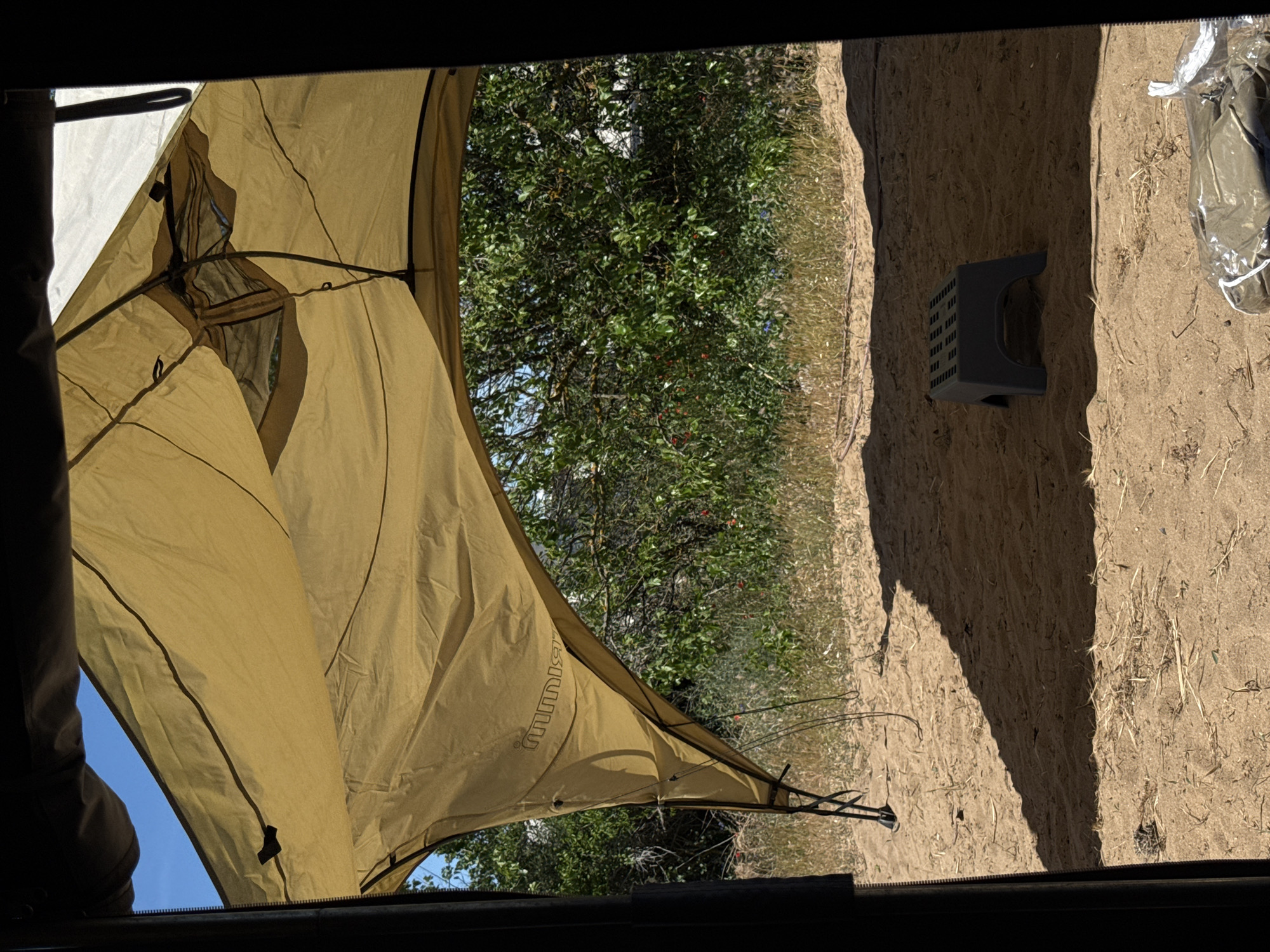 Camper sets up awning at Sozopol campsite