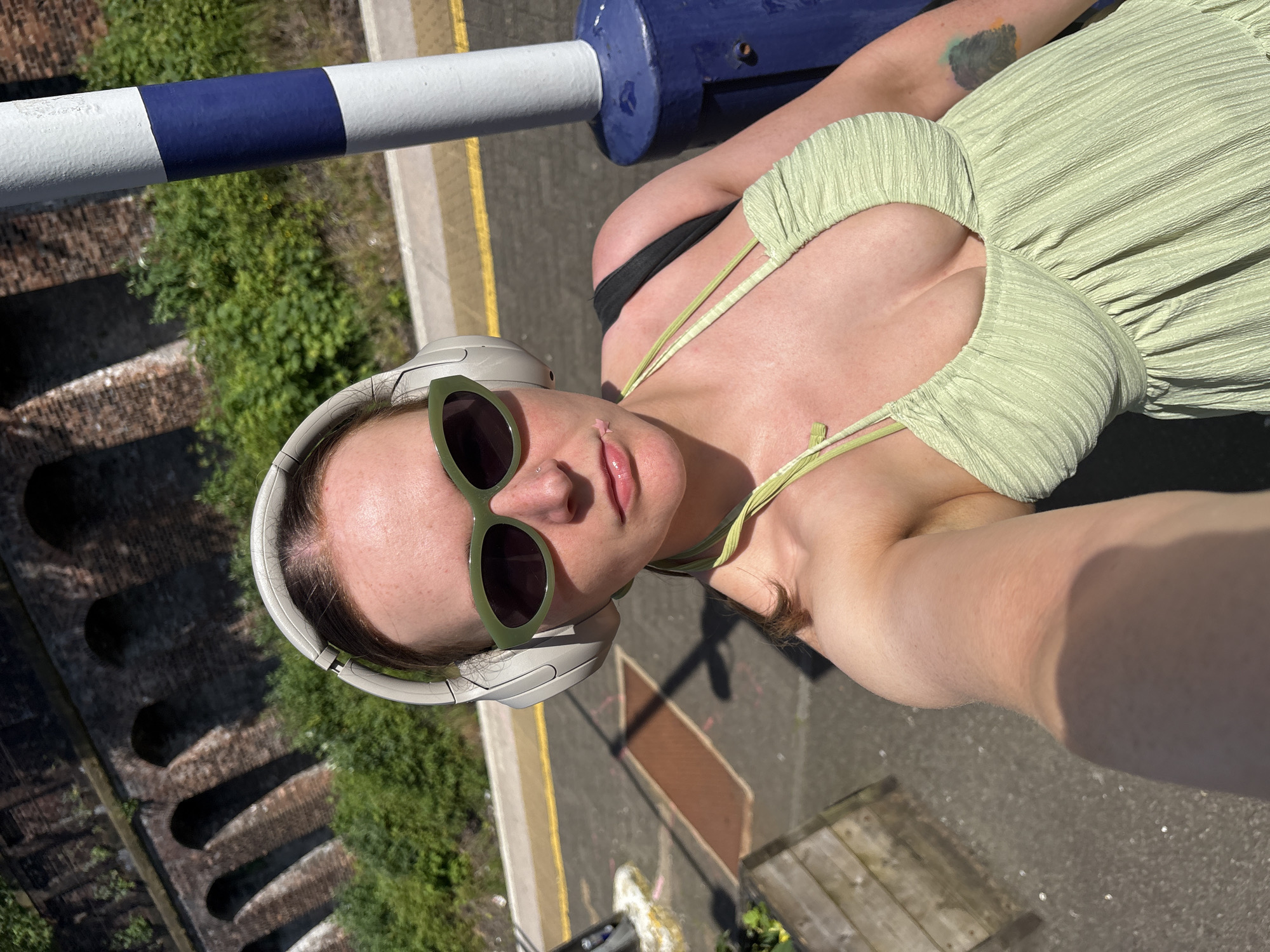 Woman takes selfie on railway bridge in Glasgow