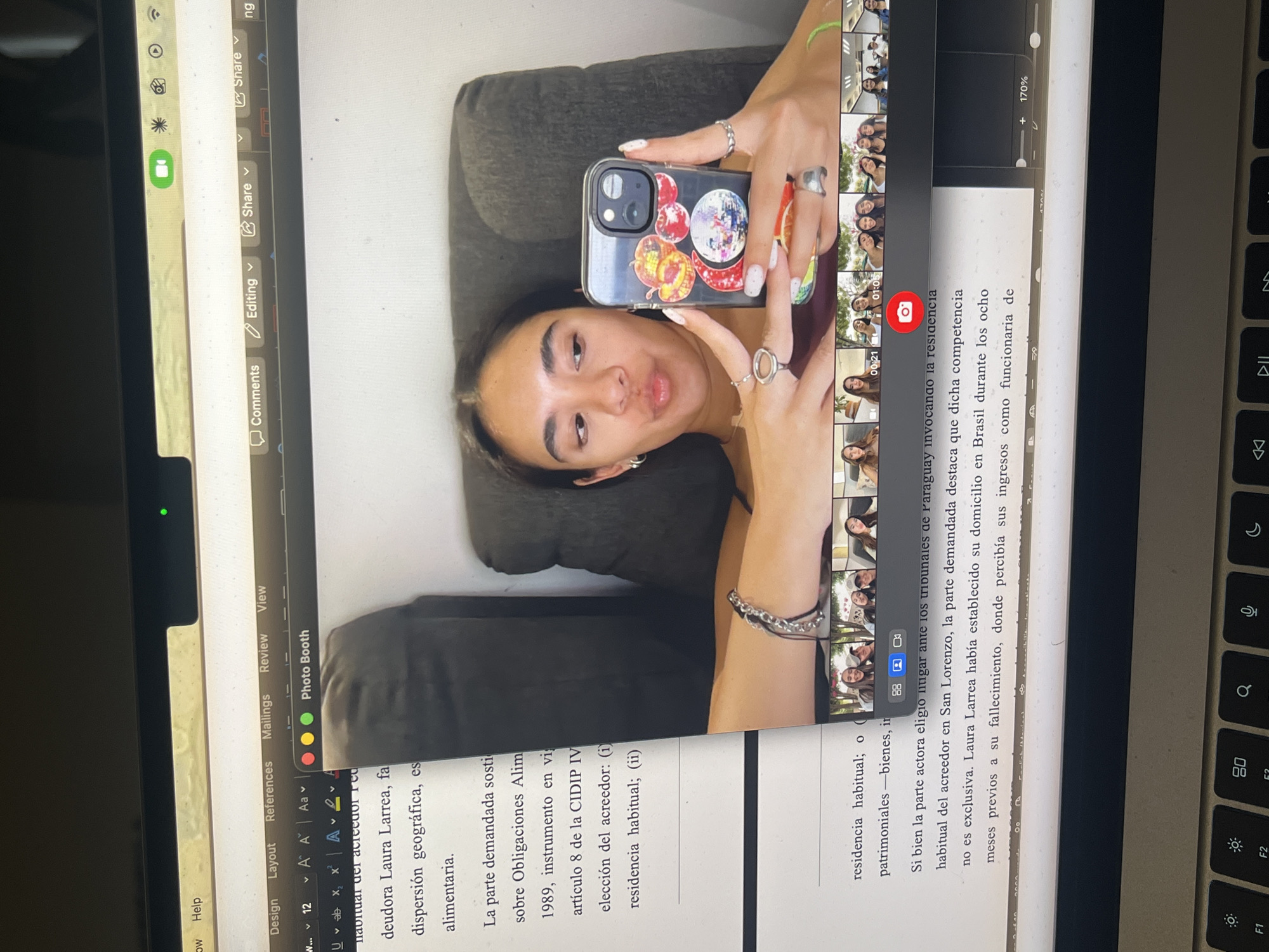 Student studies international law documents on devices in Mexico