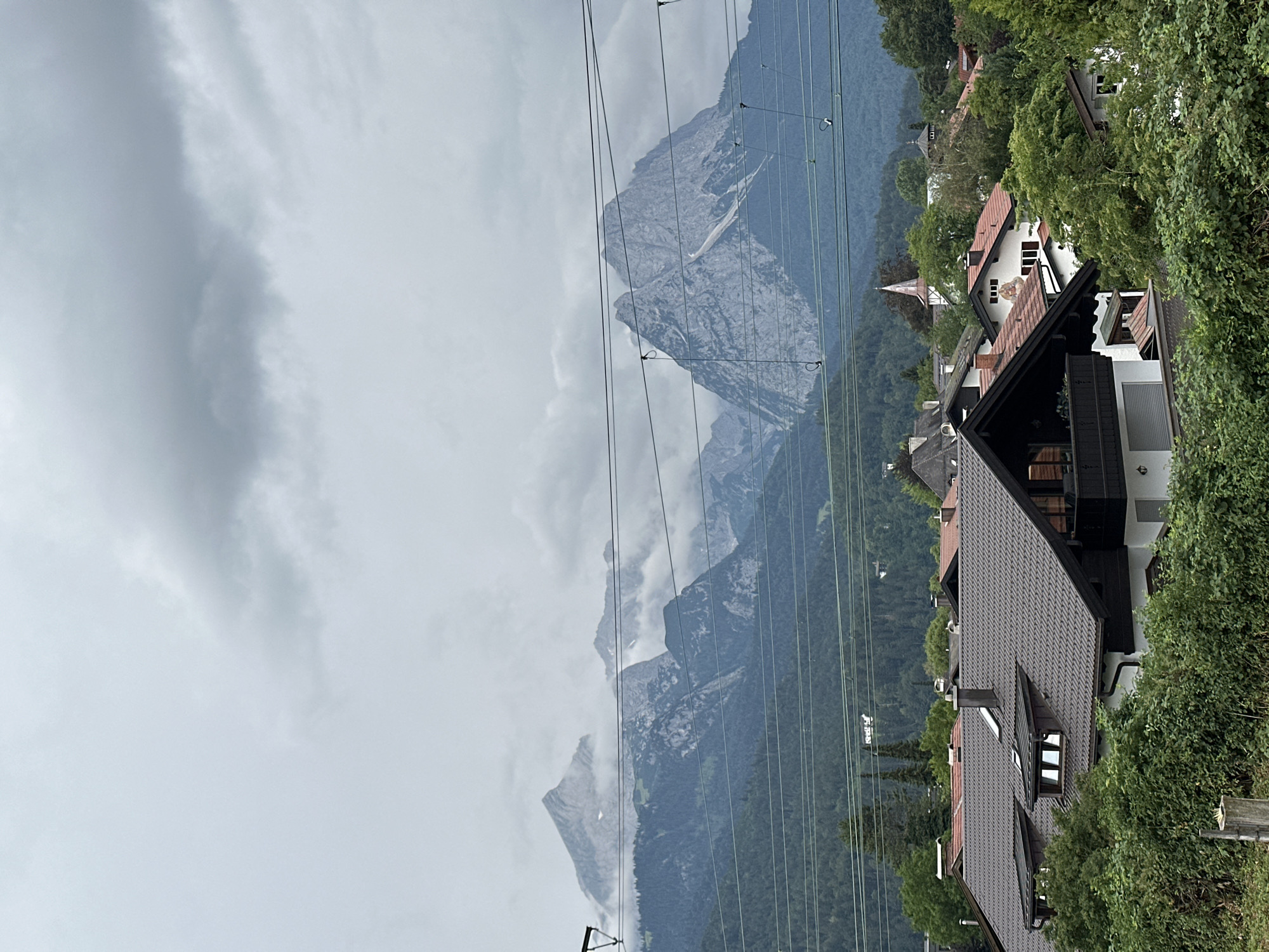 Garmisch-Partenkirchen village and Alps under overcast skies