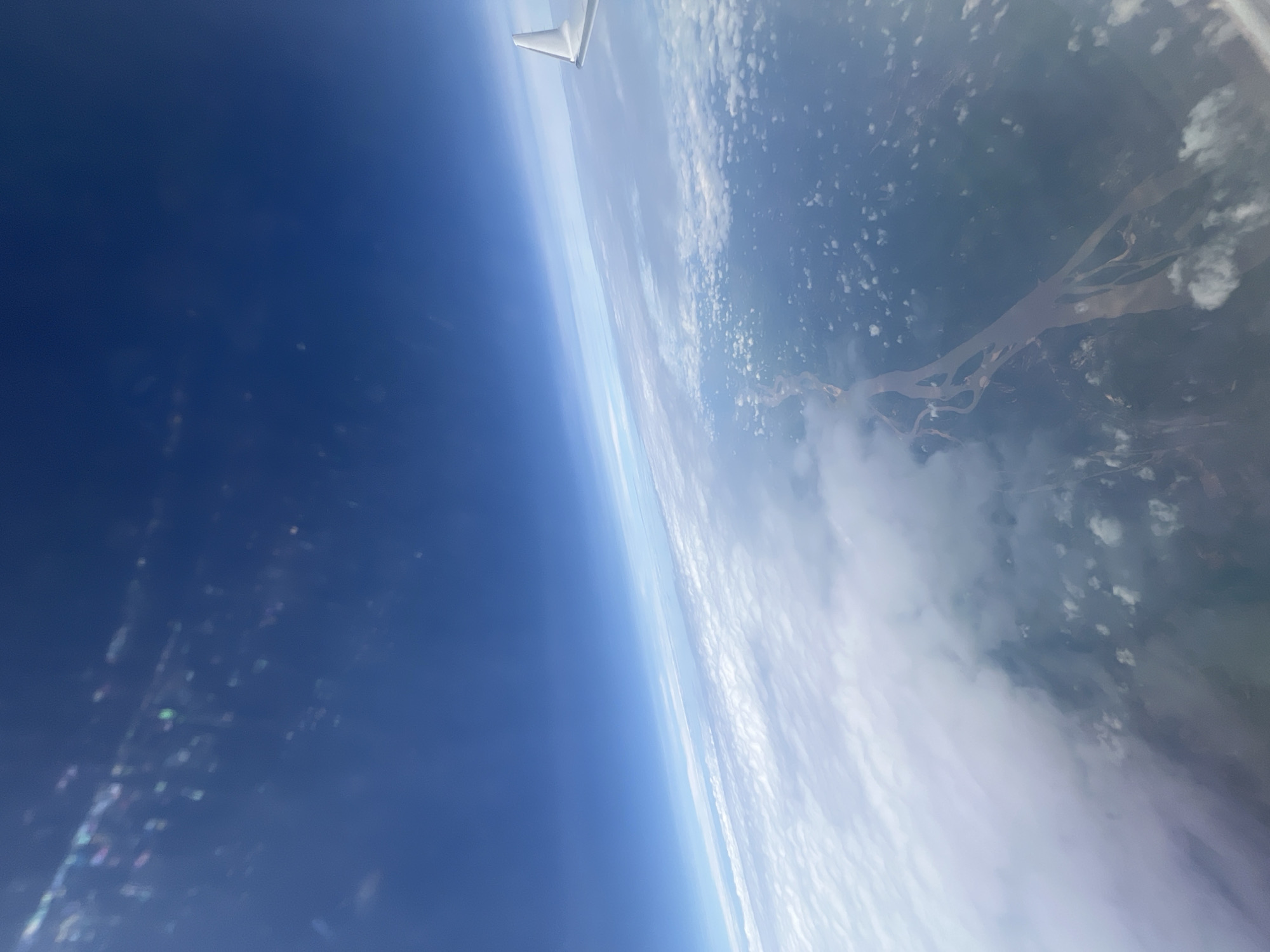 Aerial view captured over Usogba, Nigeria from aircraft window
