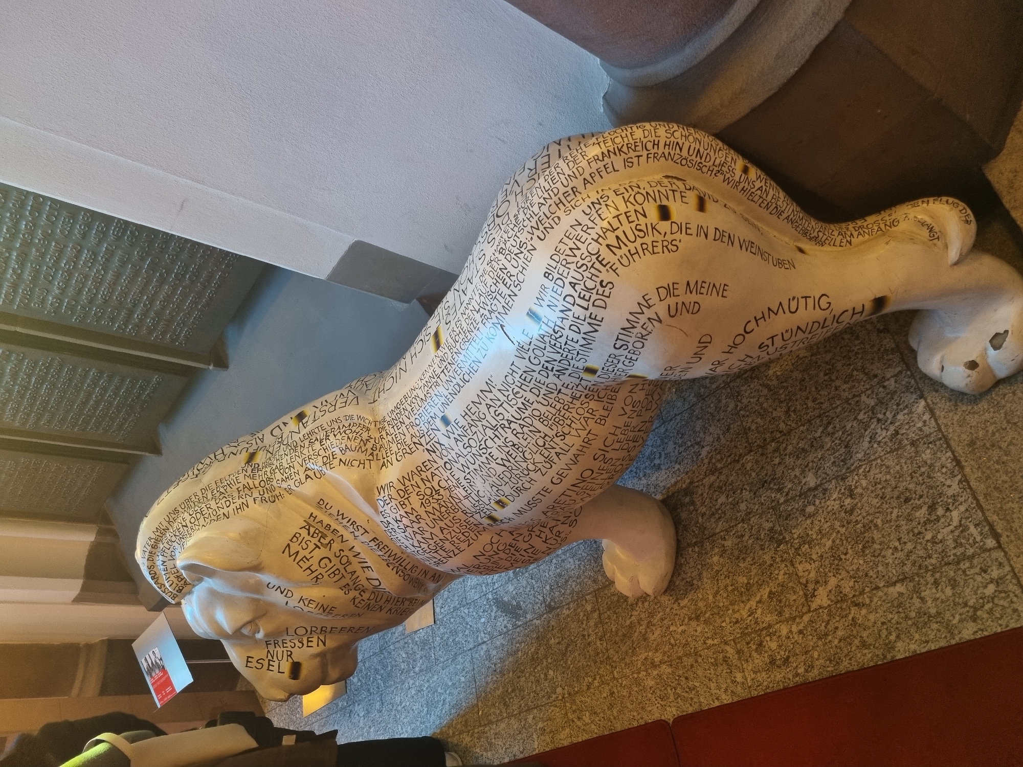 Saarbrücken cafe and graffitied lion statue documented