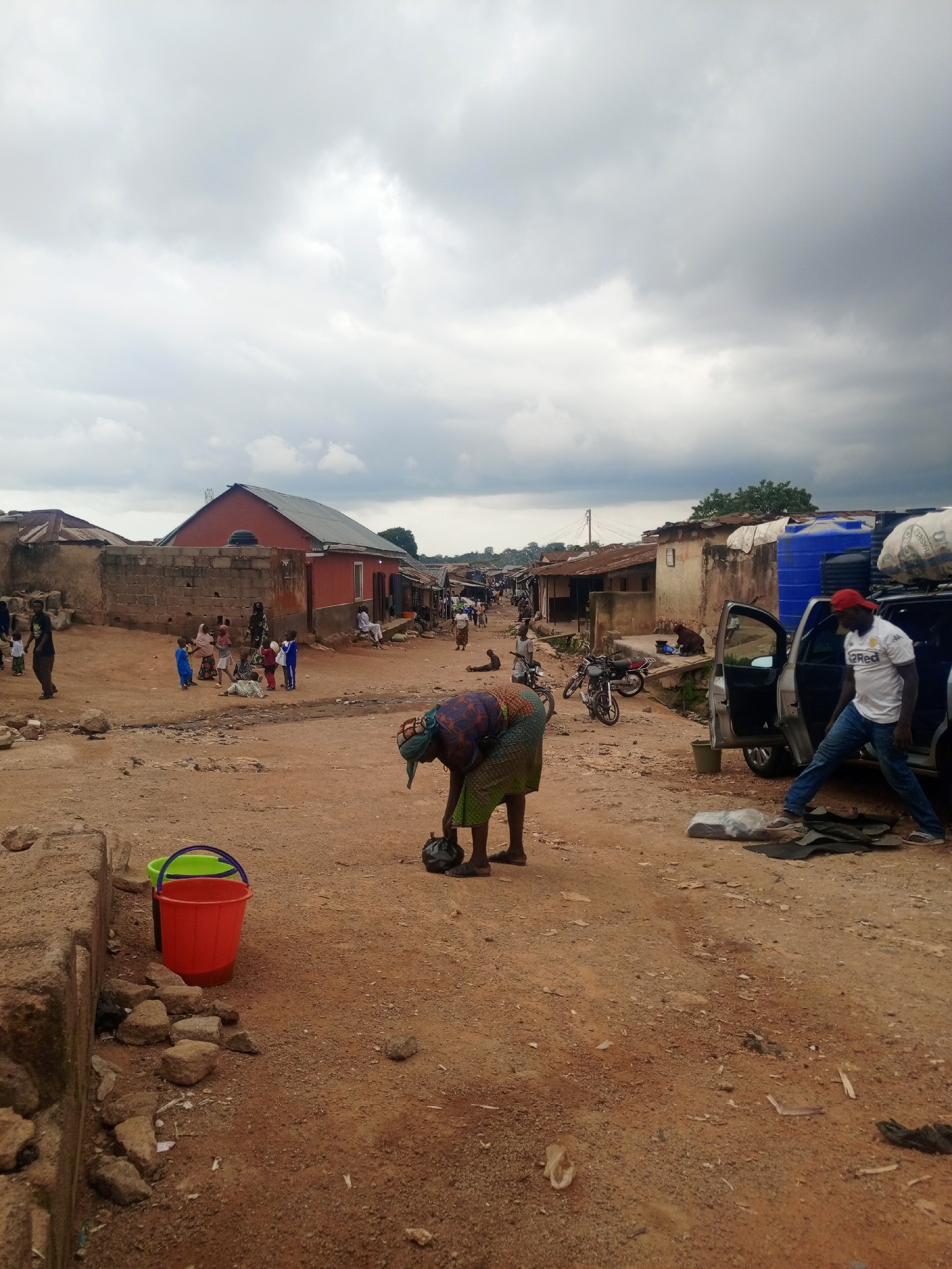 Busy street life on a grey afternoon in Jos, Nigeria