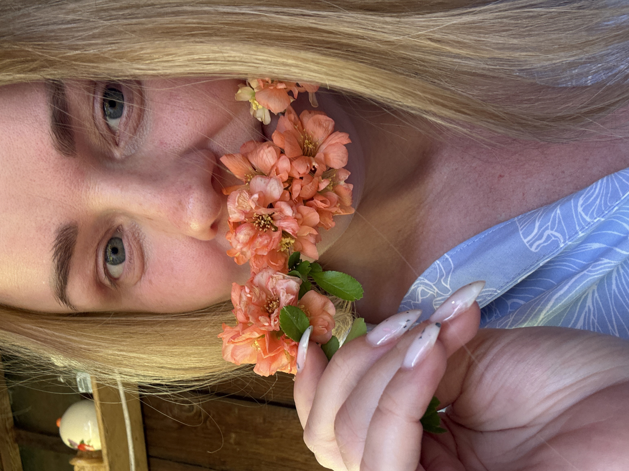 Woman photographed with orange flowers in Chaikovsky, Russia
