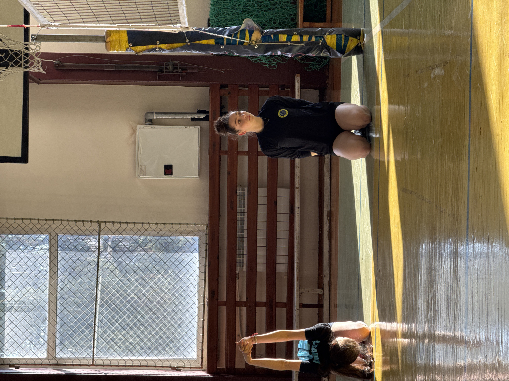 Woman exercises in Sofia gymnasium displaying Stars 94 banner