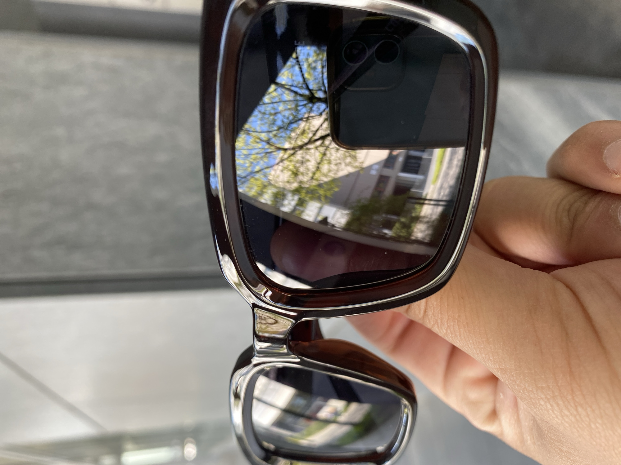 Person photographed with reflective sunglasses in Lucerne, Switzerland