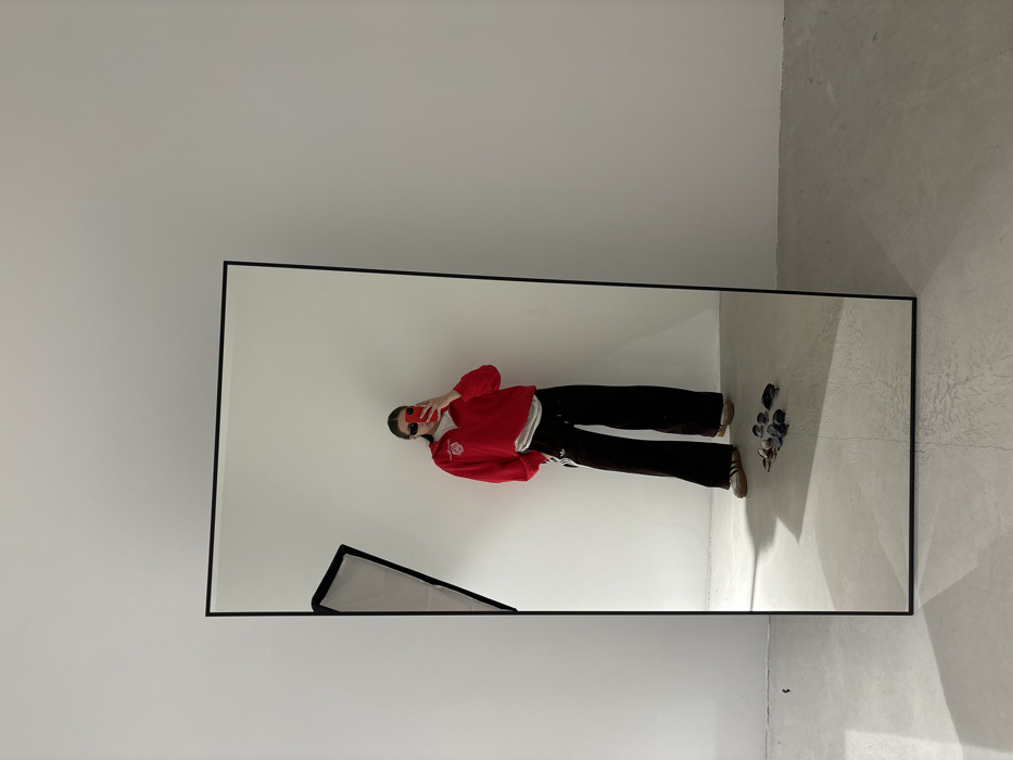 Woman conducts mirror selfie photo session in Krasnodar studio