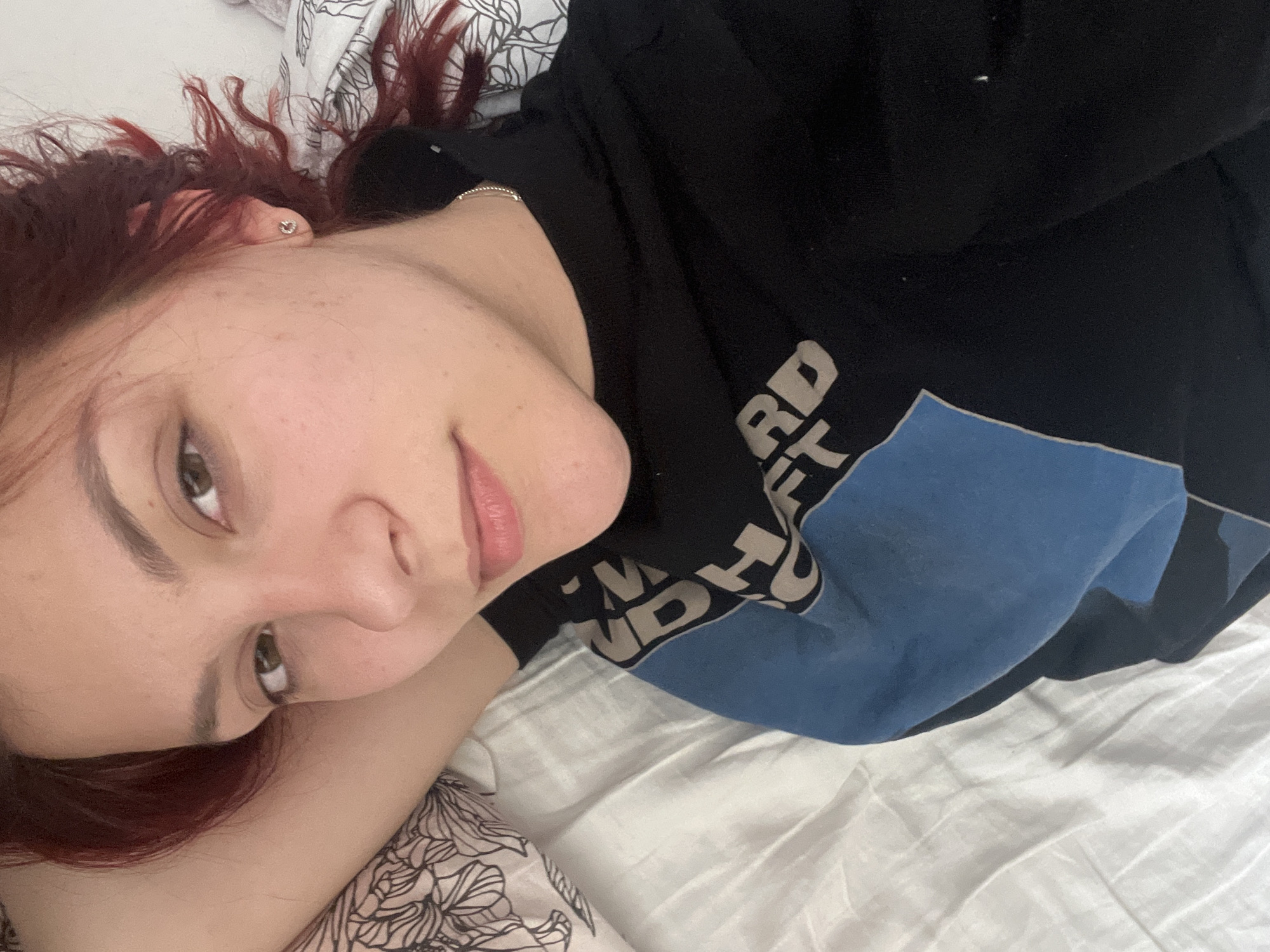Woman rests on bed in Sofia apartment