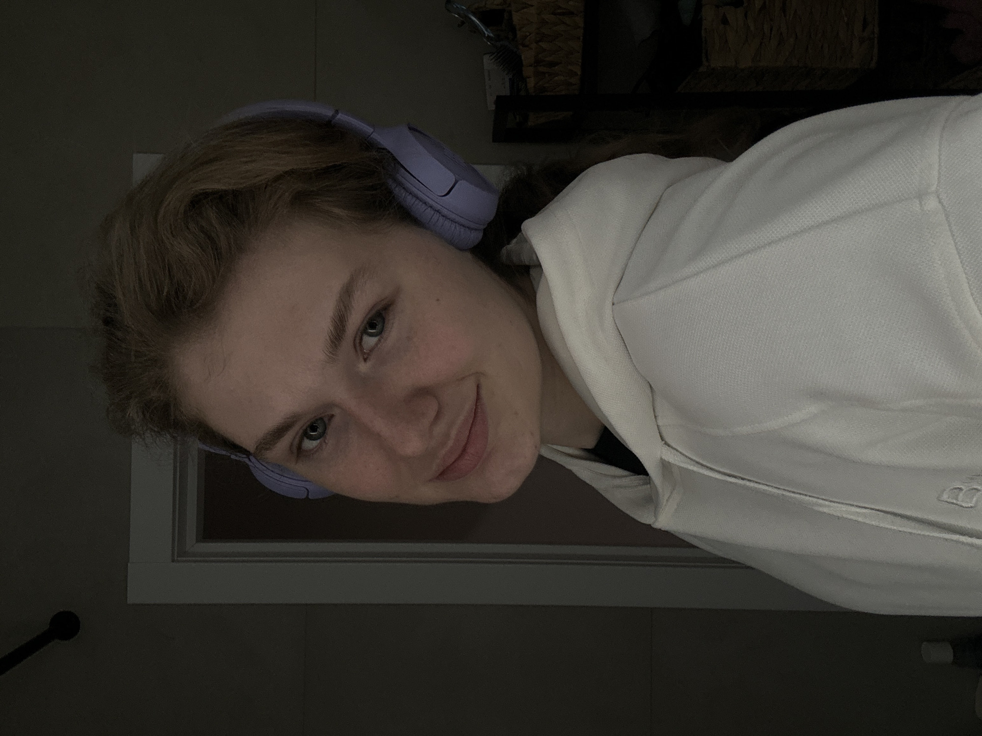Woman in headphones photographed indoors in Kazan