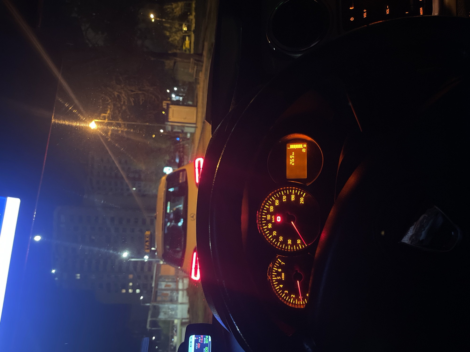 Driver stopped behind taxi during nighttime in Sliven, Bulgaria