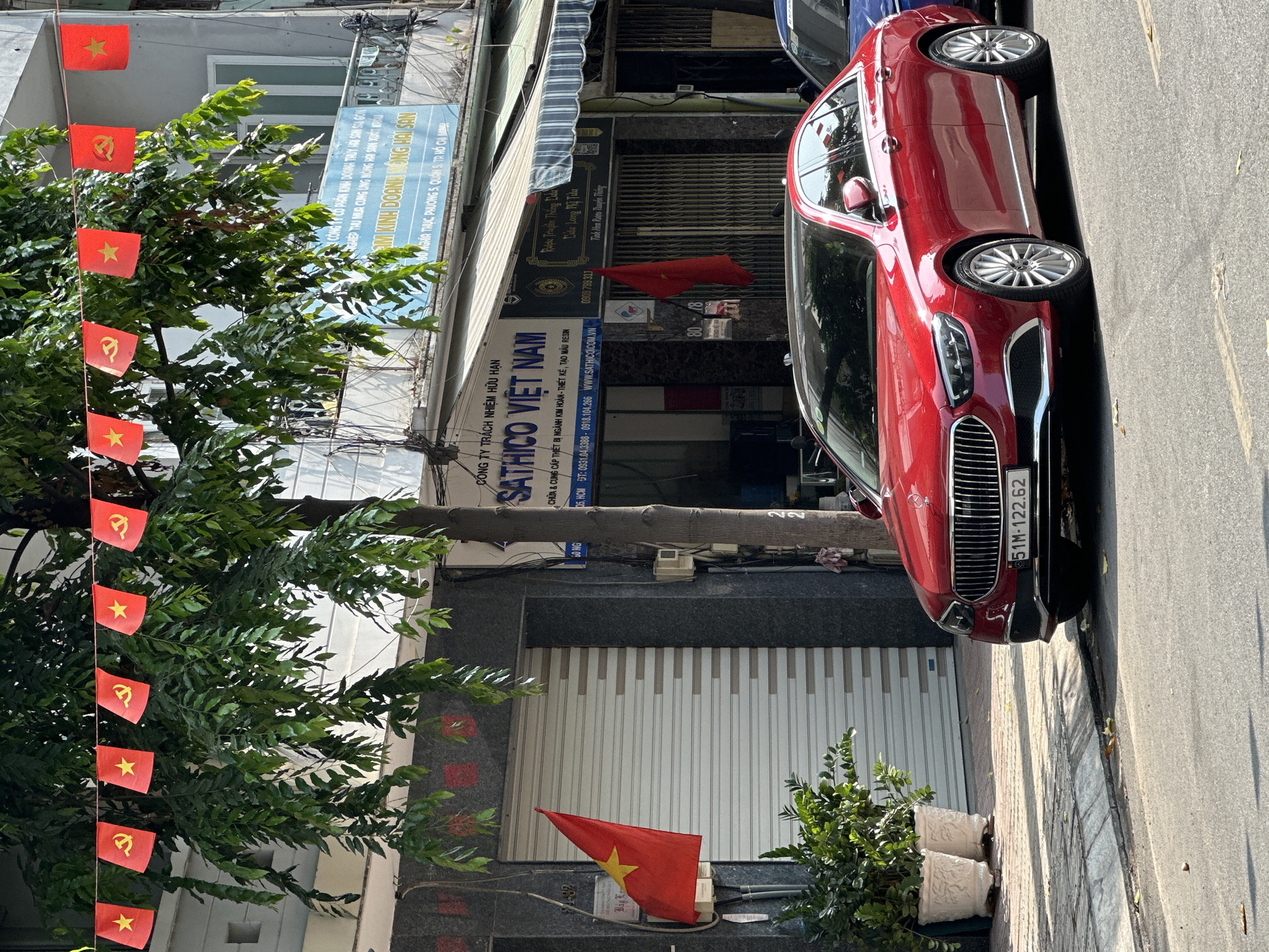 Street scene captured in Ho Chi Minh City with flags