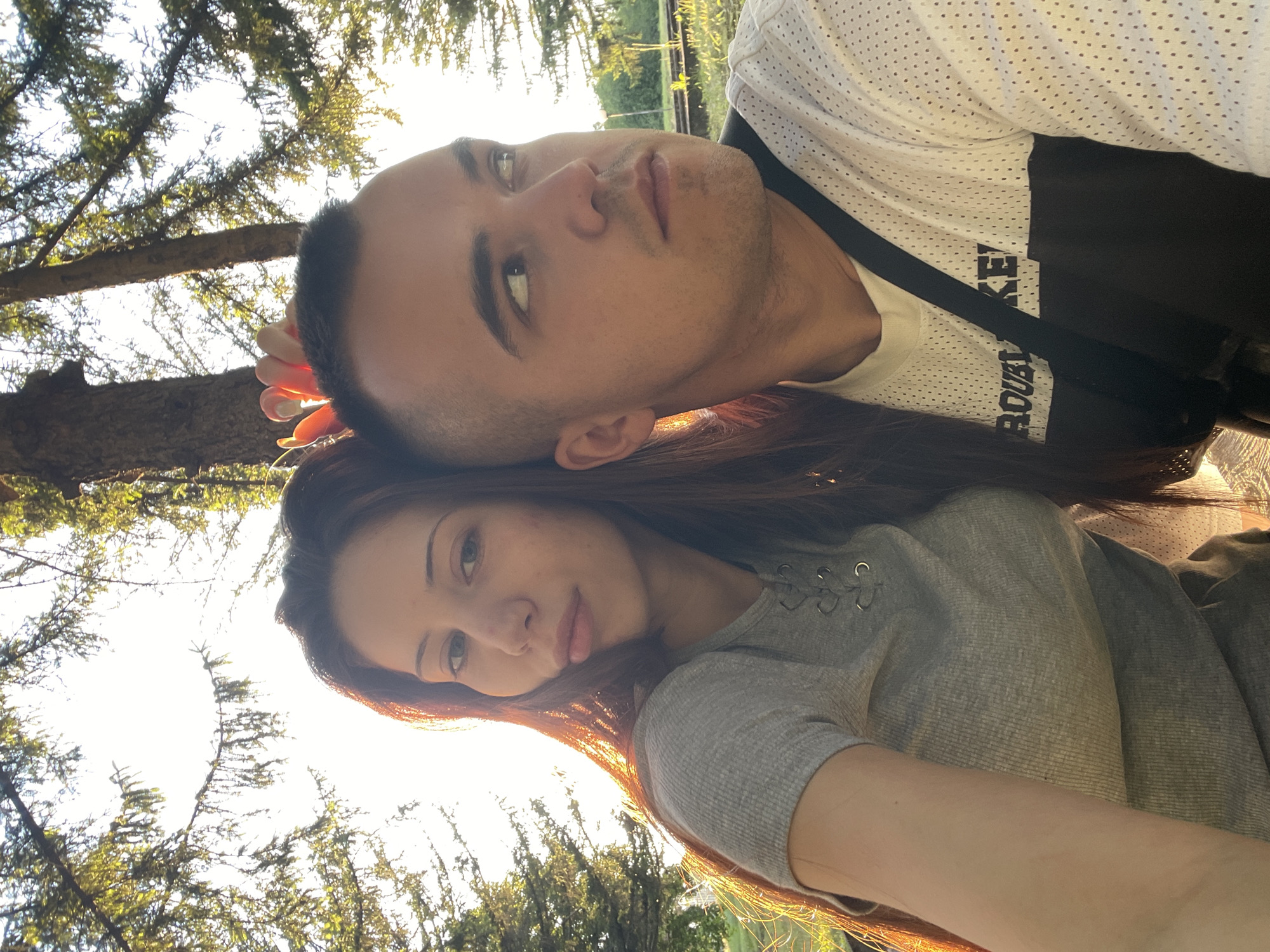 Couple's outdoor photo session in sunny park setting