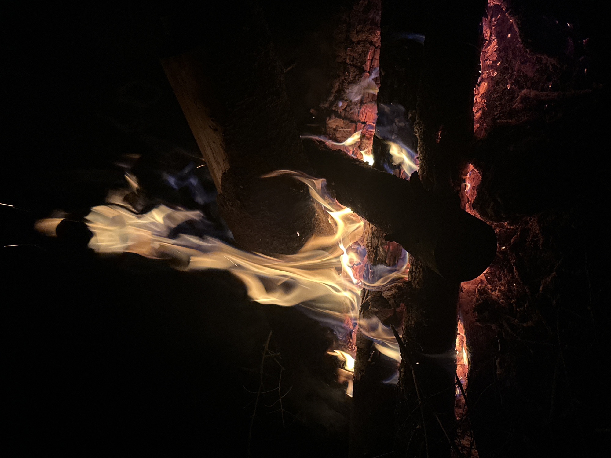 Campfire burns intensely in rural Belarus village night