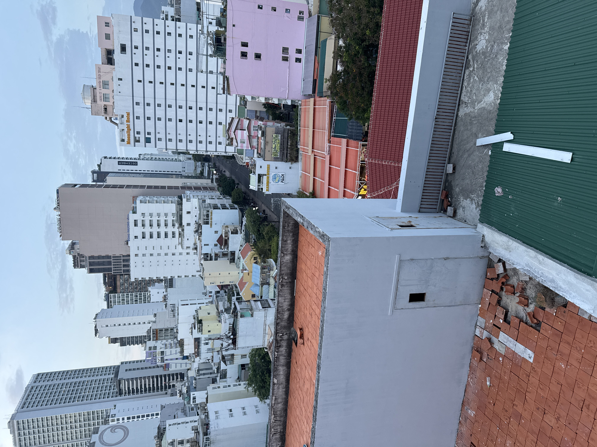 Rooftop views across Nha Trang's dense urban skyline at dusk