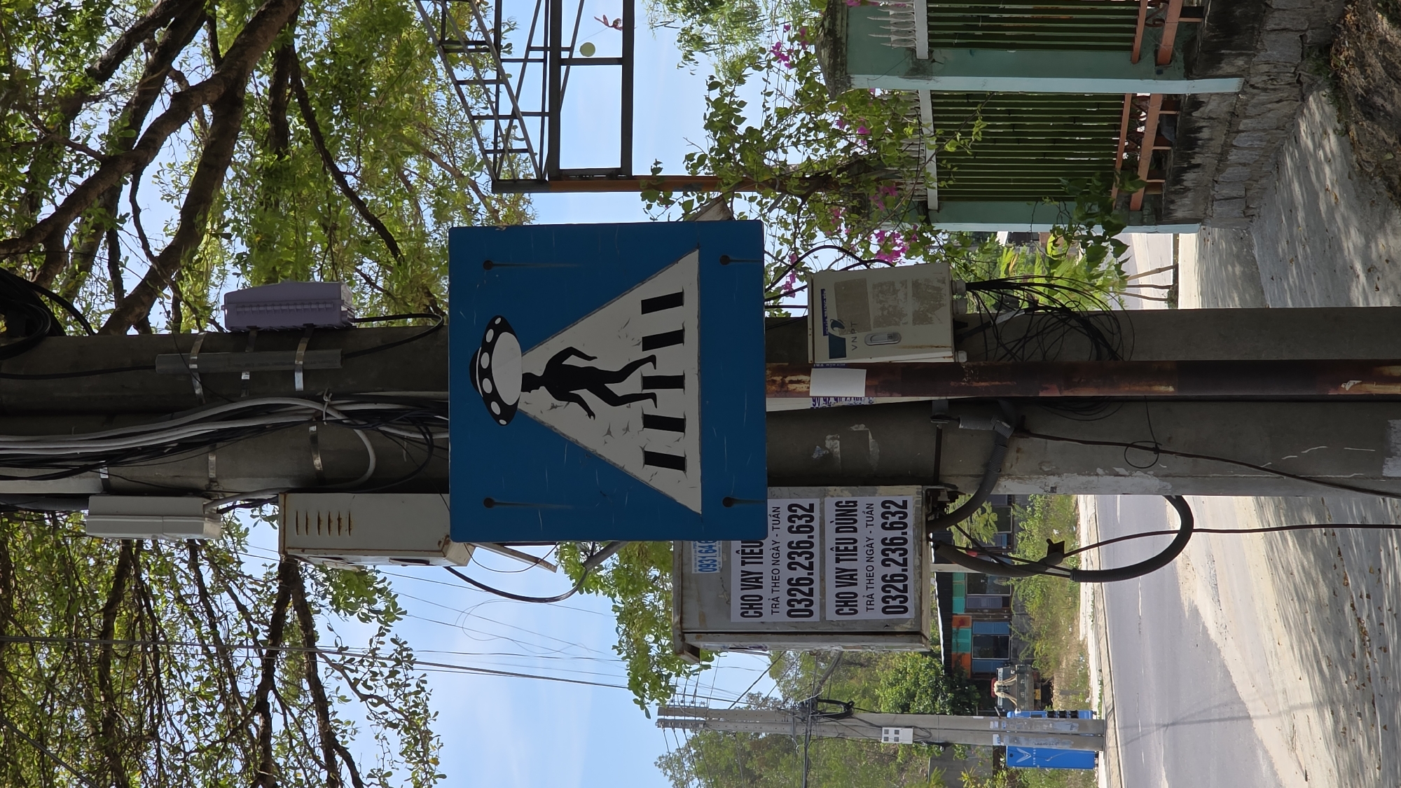 Unusual UFO-themed pedestrian crossing sign spotted in Nha Trang