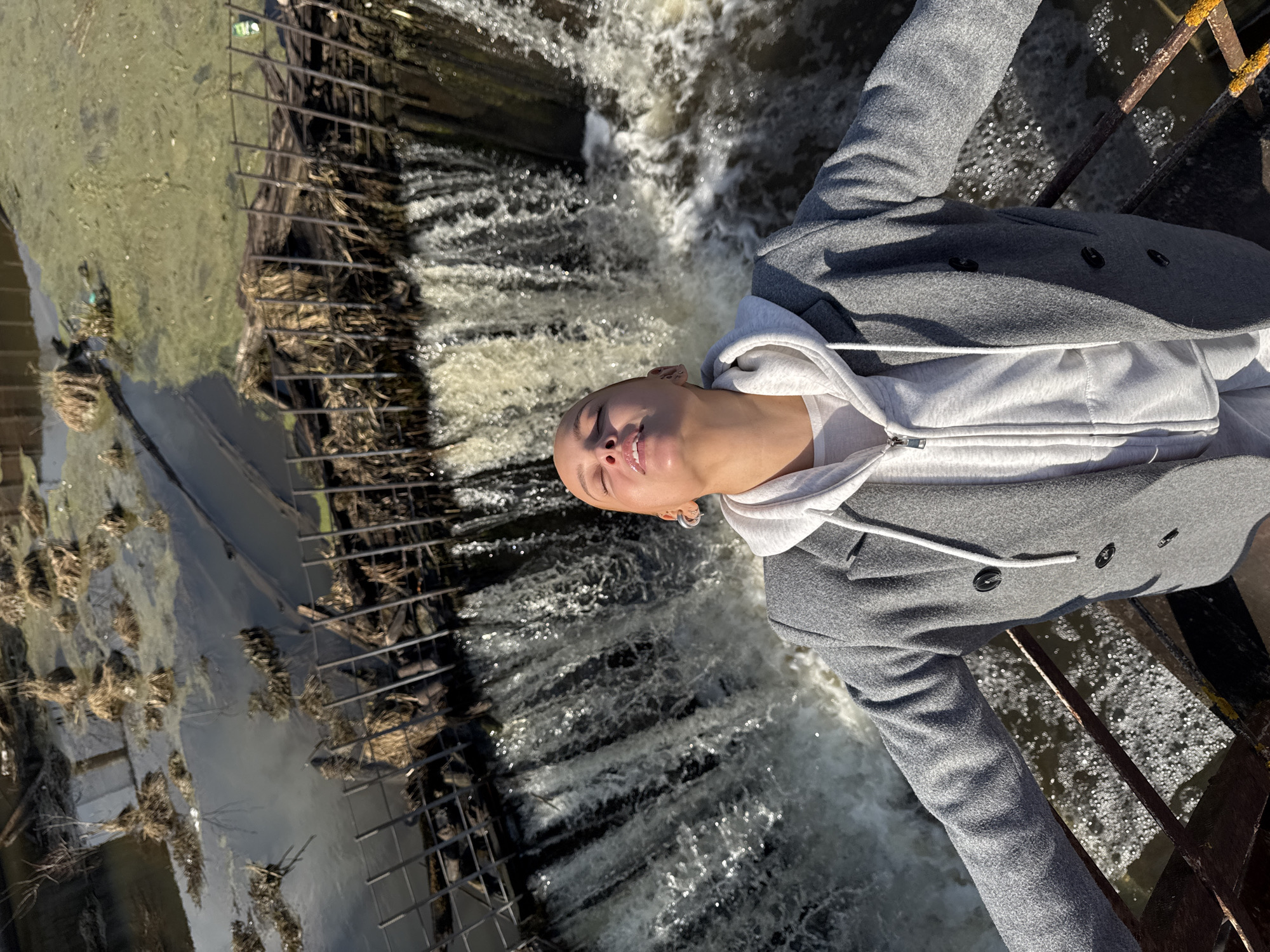 Woman observed at dam edge in Rusalevka, Russia