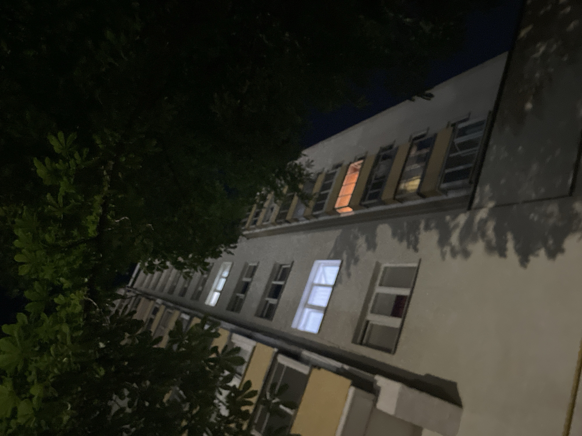 Late-night walk around an illuminated stadium and its surroundings