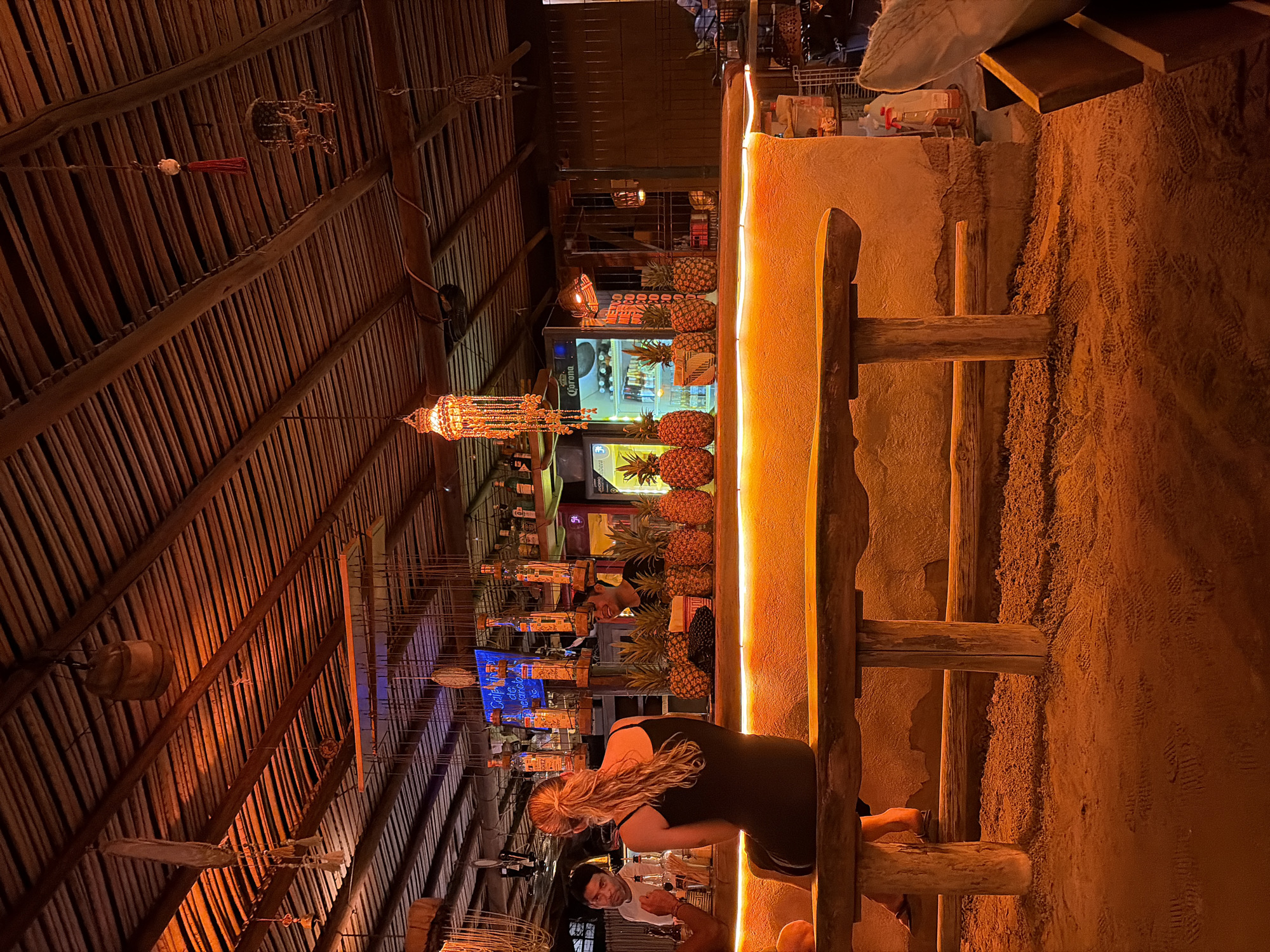 Dimly lit bar interior captured in Brisas de Zicatela