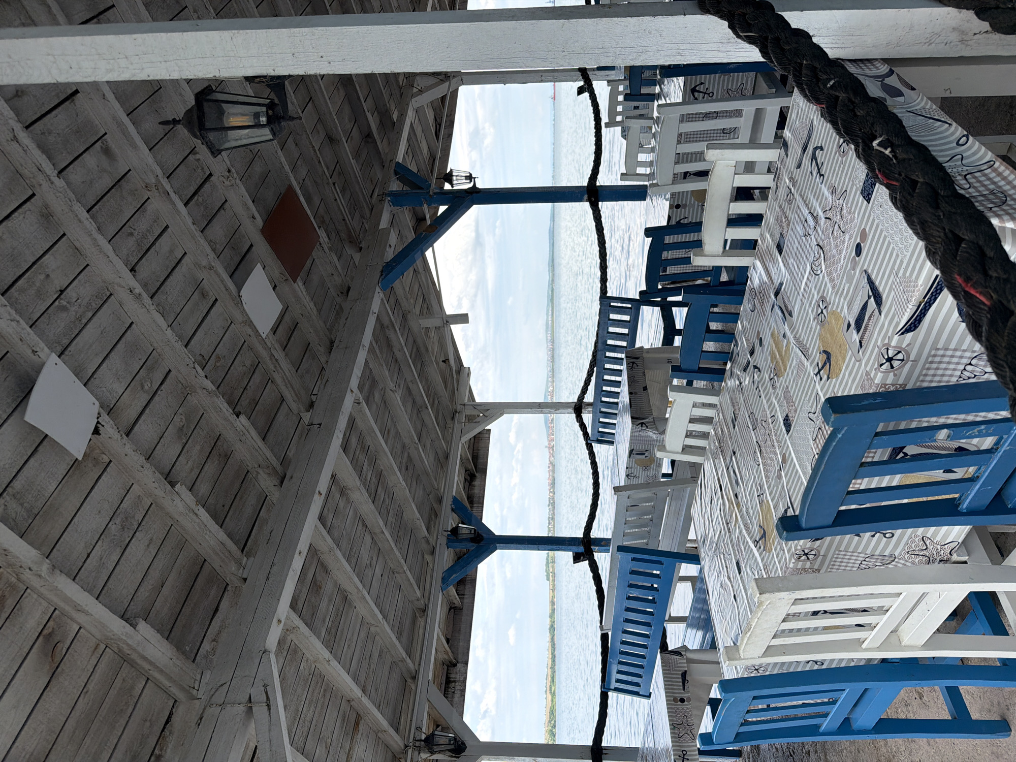 Tourist documents peaceful Burgas waterfront scene with restaurants, marina