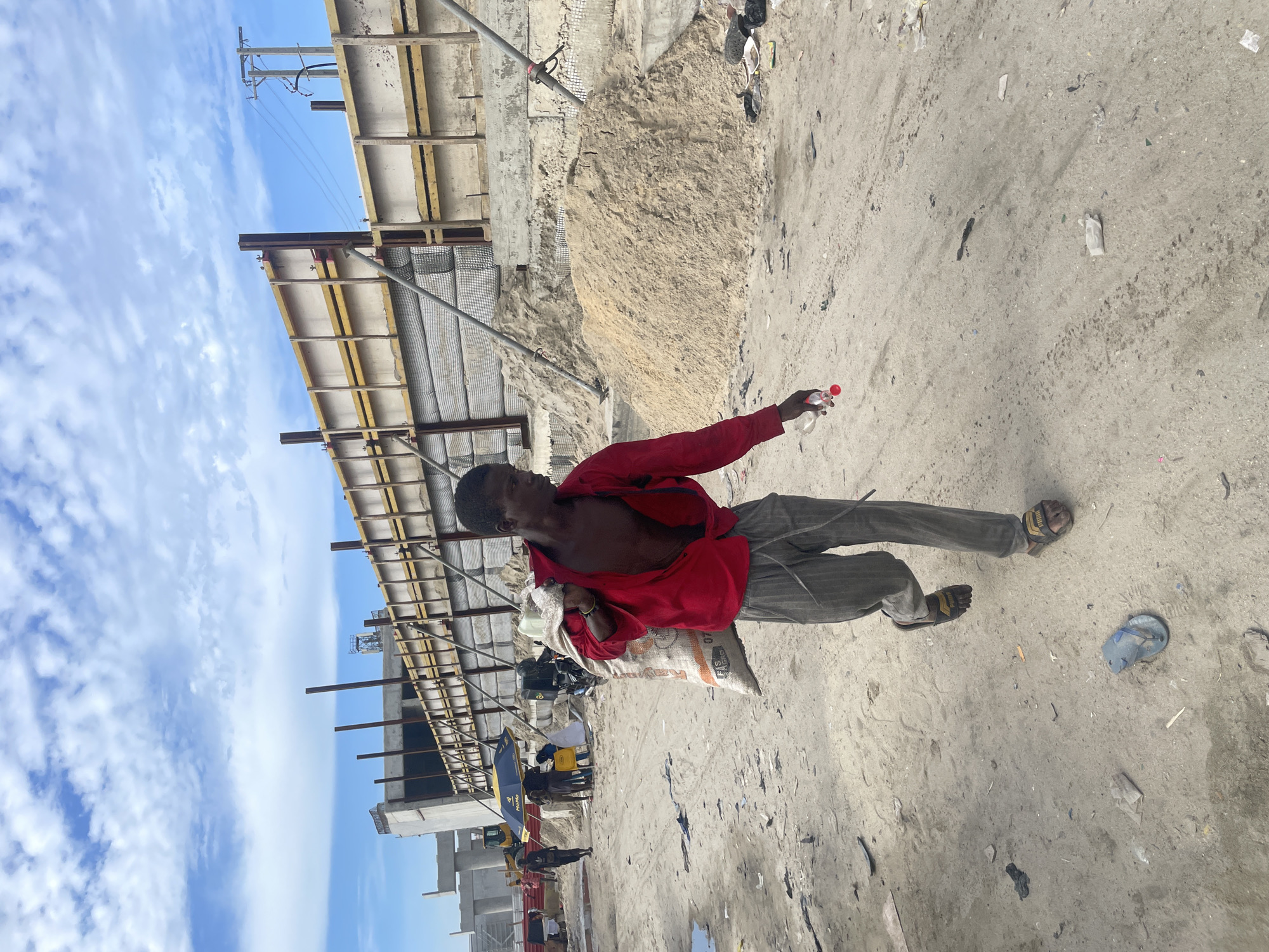 Daily life unfolds amid construction and flooding in Ilado