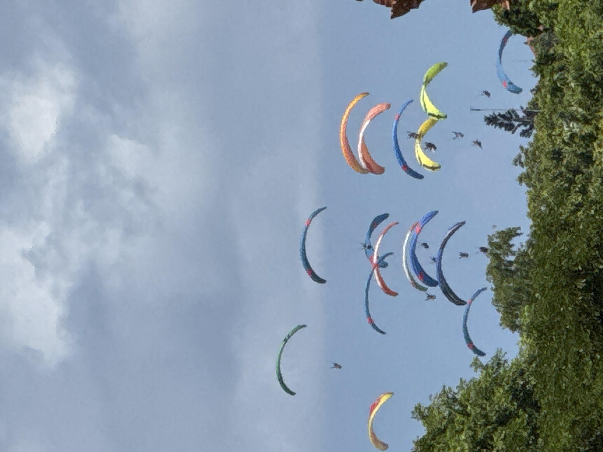Multiple paragliders spotted in Indonesian skies amid clouds
