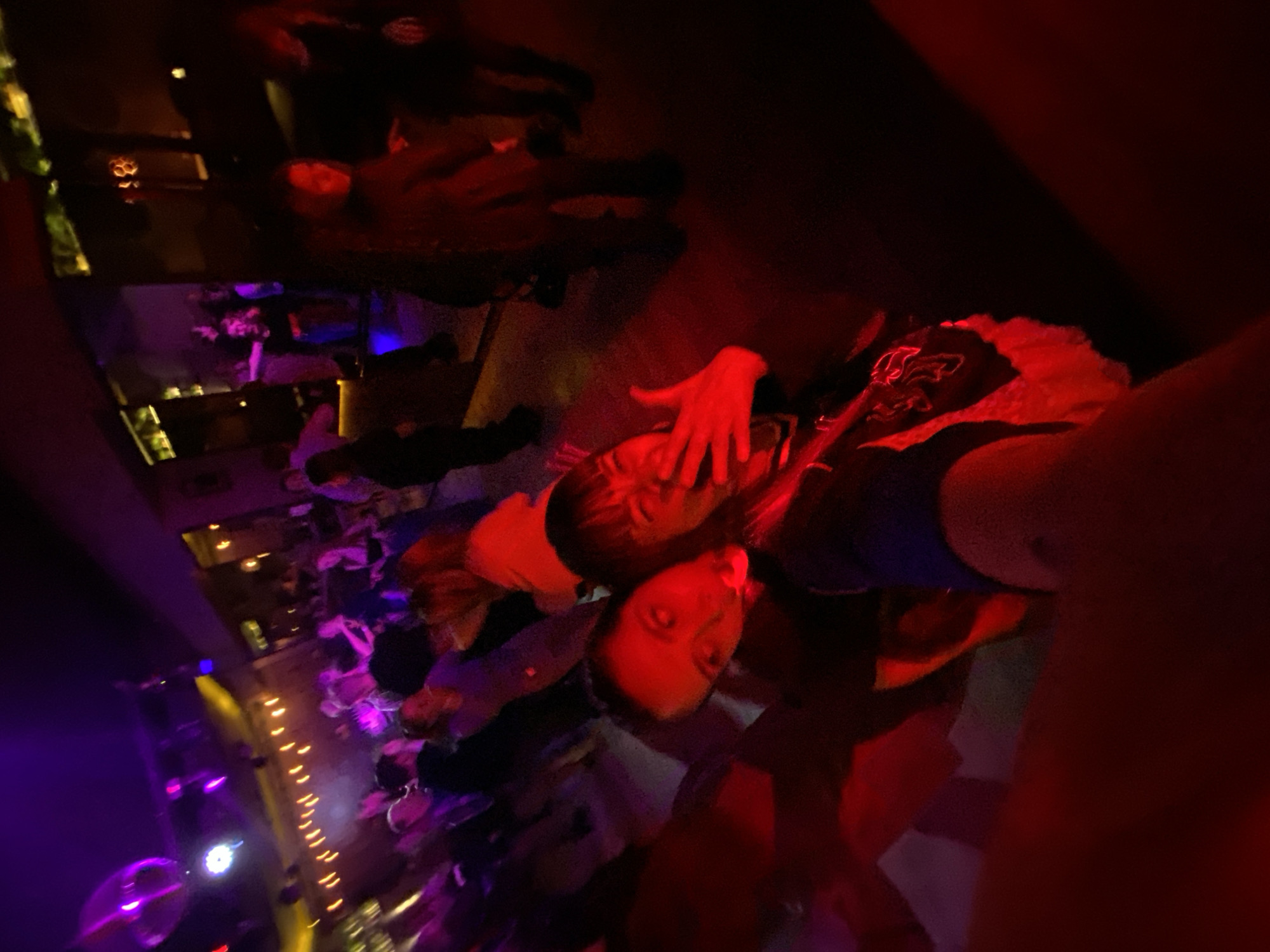 Nightclub scene captured by witnesses in atmospheric lighting