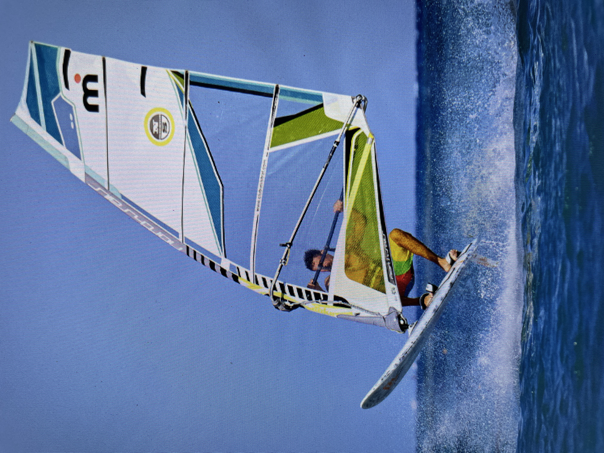 Windsurfer and kiteboarder active off Bacong Philippines coast