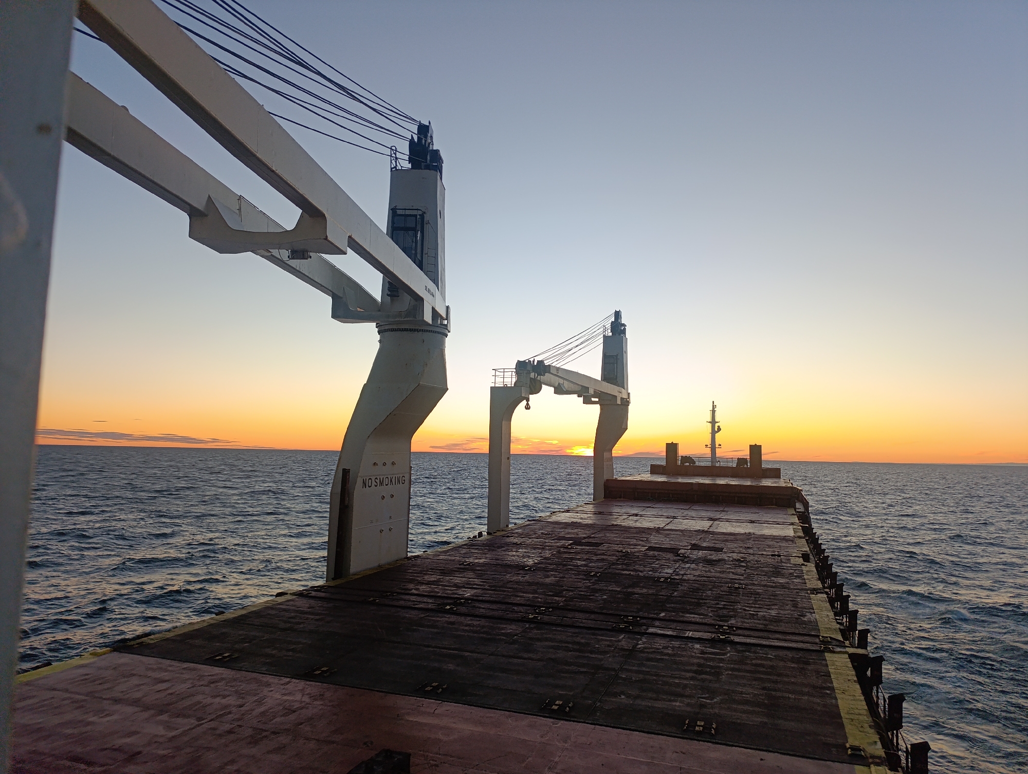 Cargo ship deck at sunset off the Finnish coast