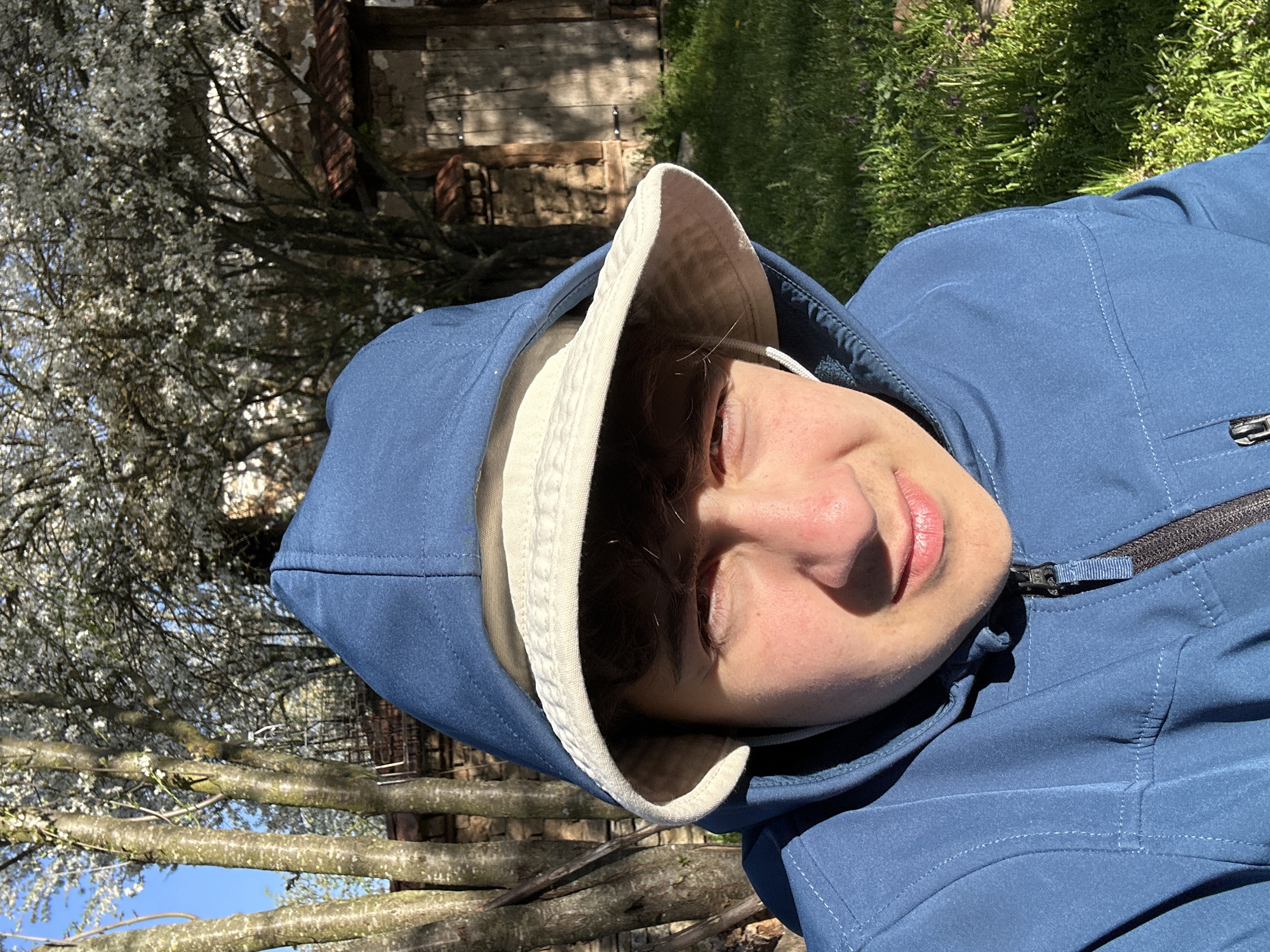 Person takes outdoor tech break in Bulgarian town park