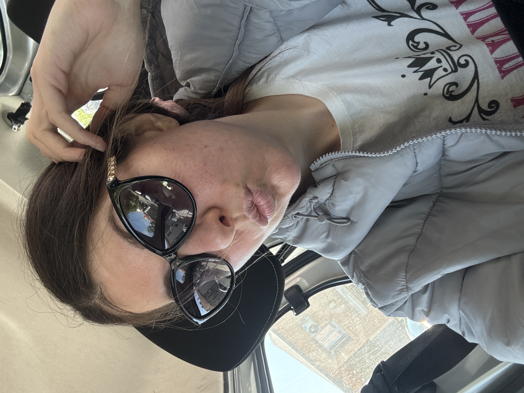 Woman observed in vehicle wearing casual winter attire
