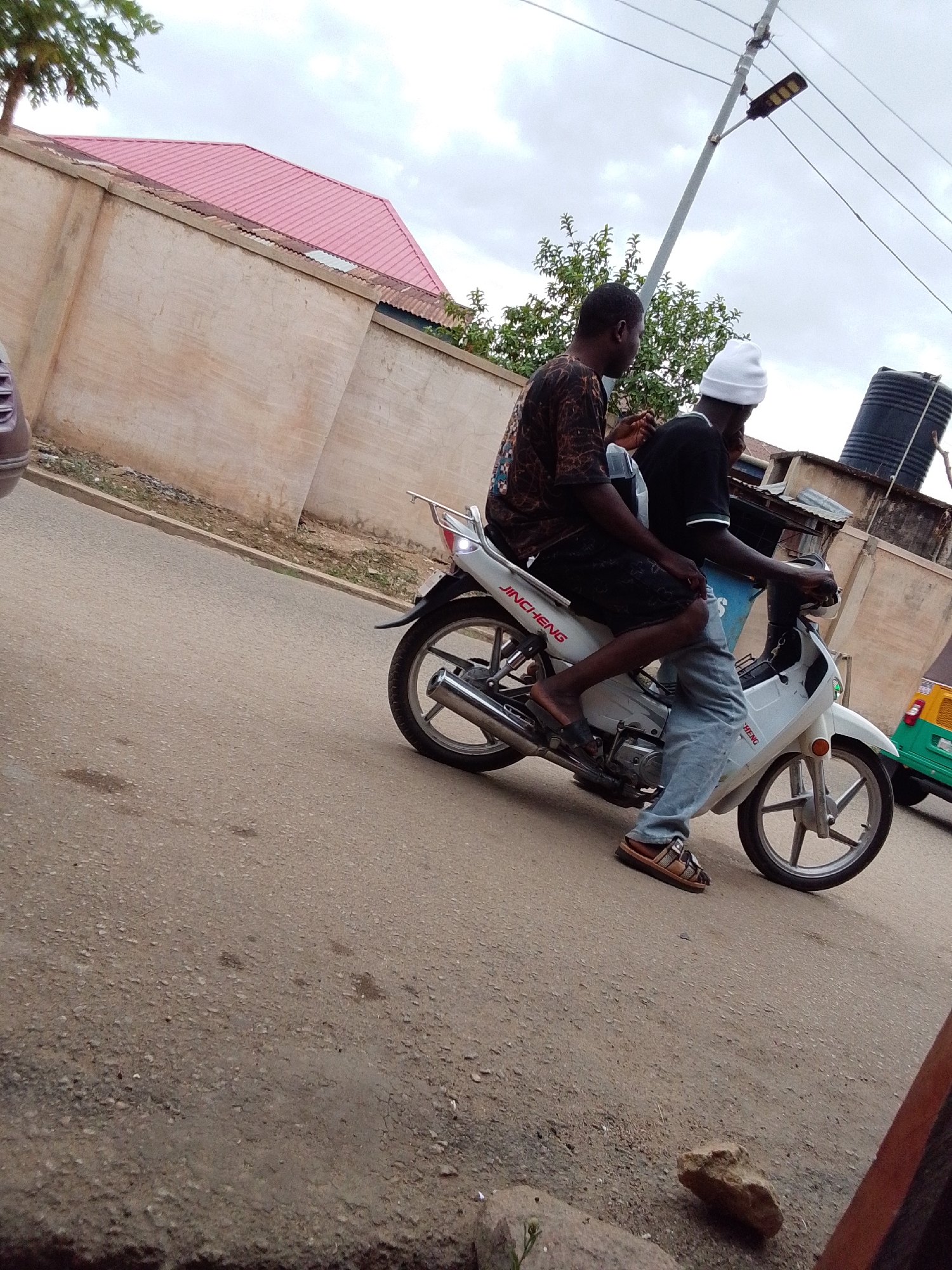 Daily life scenes captured: scooter ride, barbershop visits, street moments