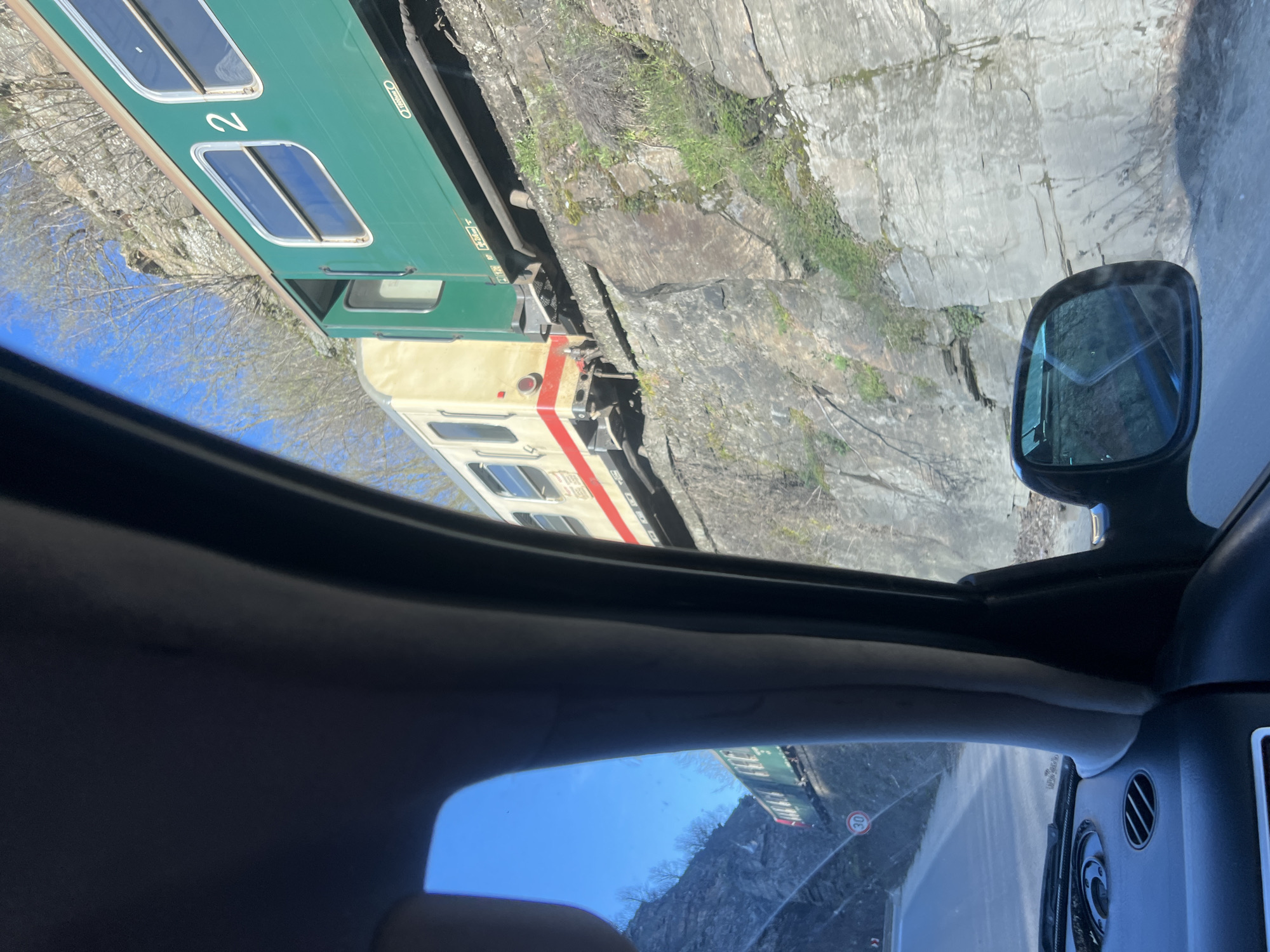 Train spotted running alongside cliff near Dorkovo, Bulgaria