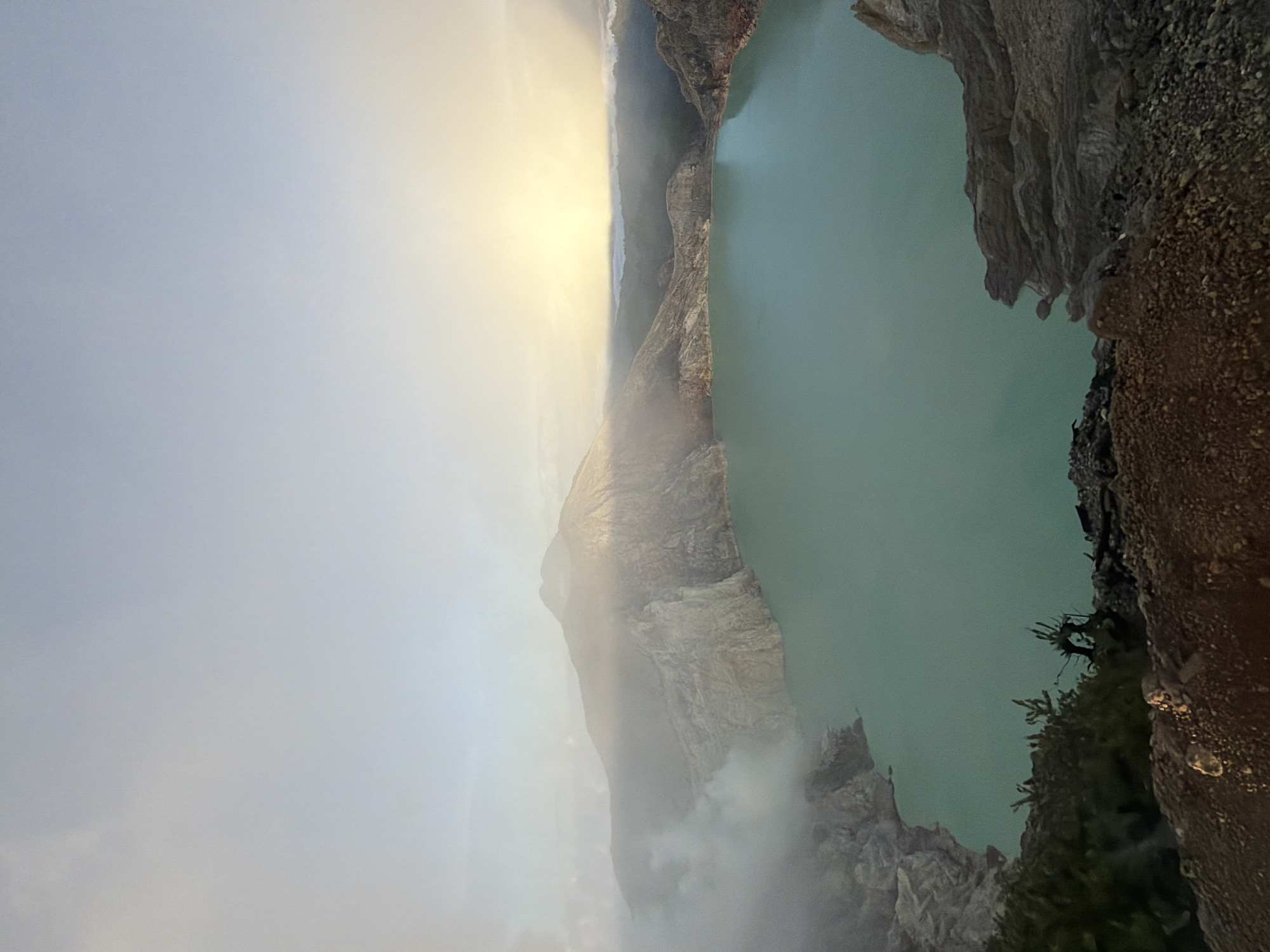 Sunrise crowds gather at Kawah Ijen's crater rim in East Java