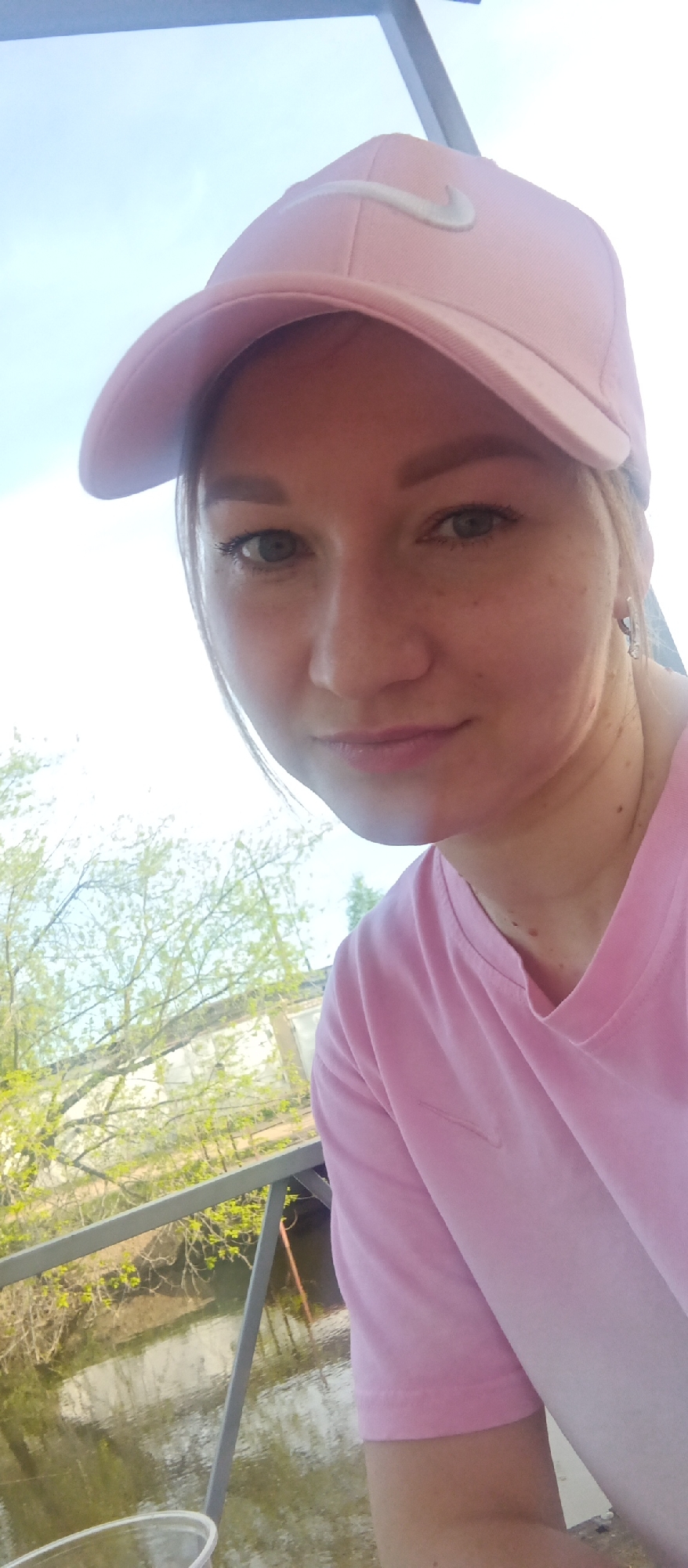 Woman in pink spotted on waterfront deck