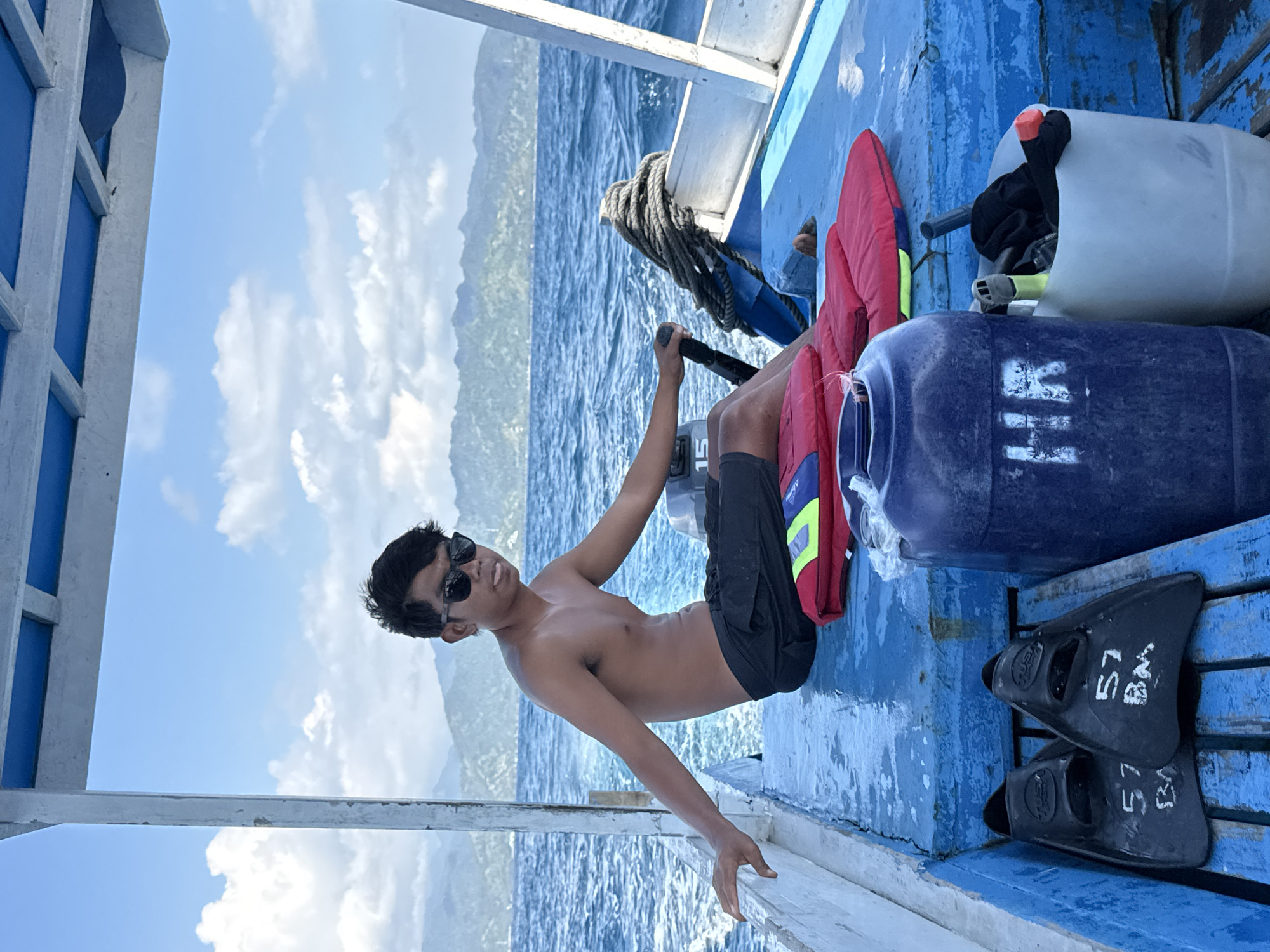 Relaxing on a blue-decked boat off the Indonesian coast