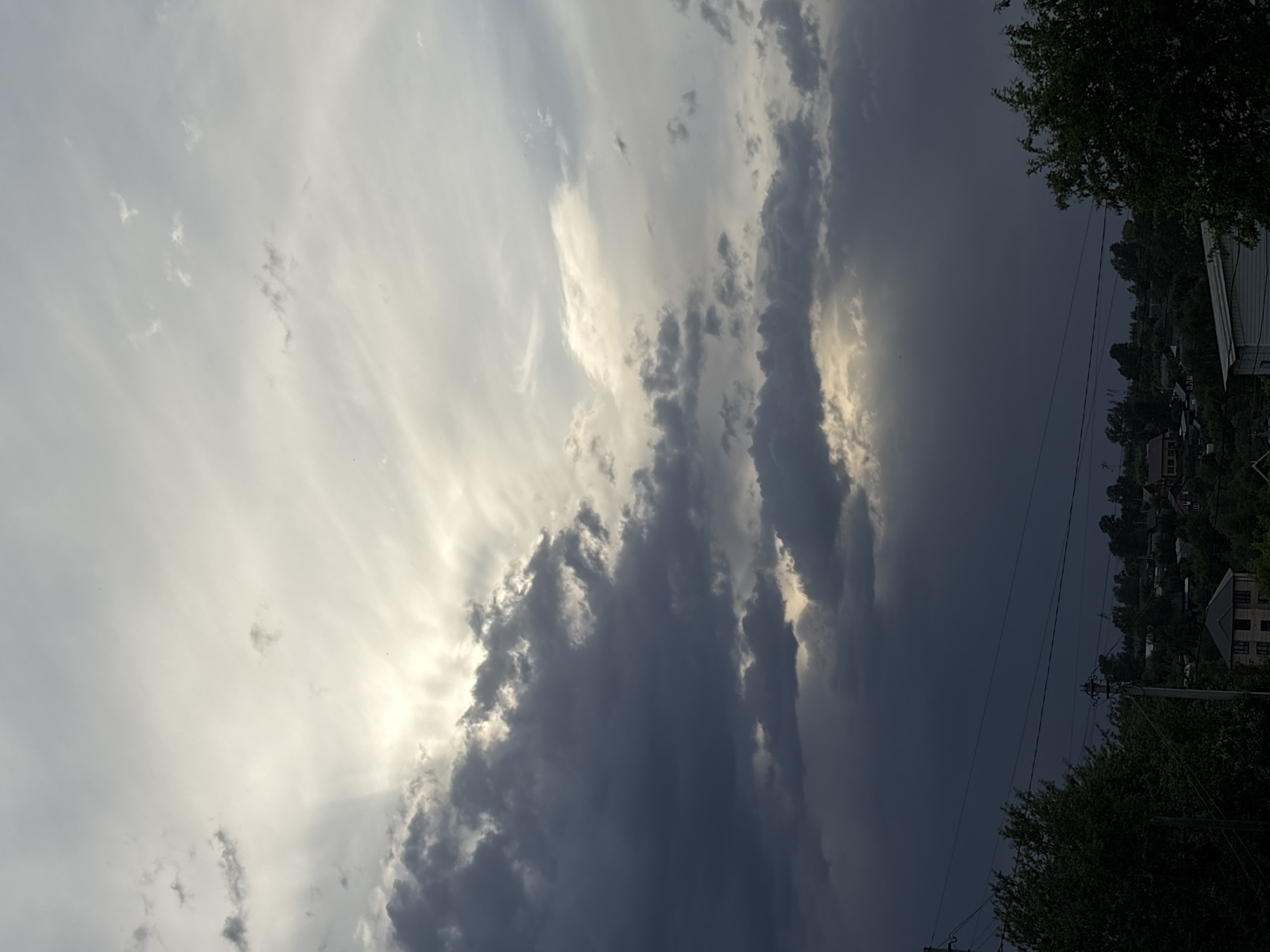 Woman photographed in Russian village as storm clouds gather