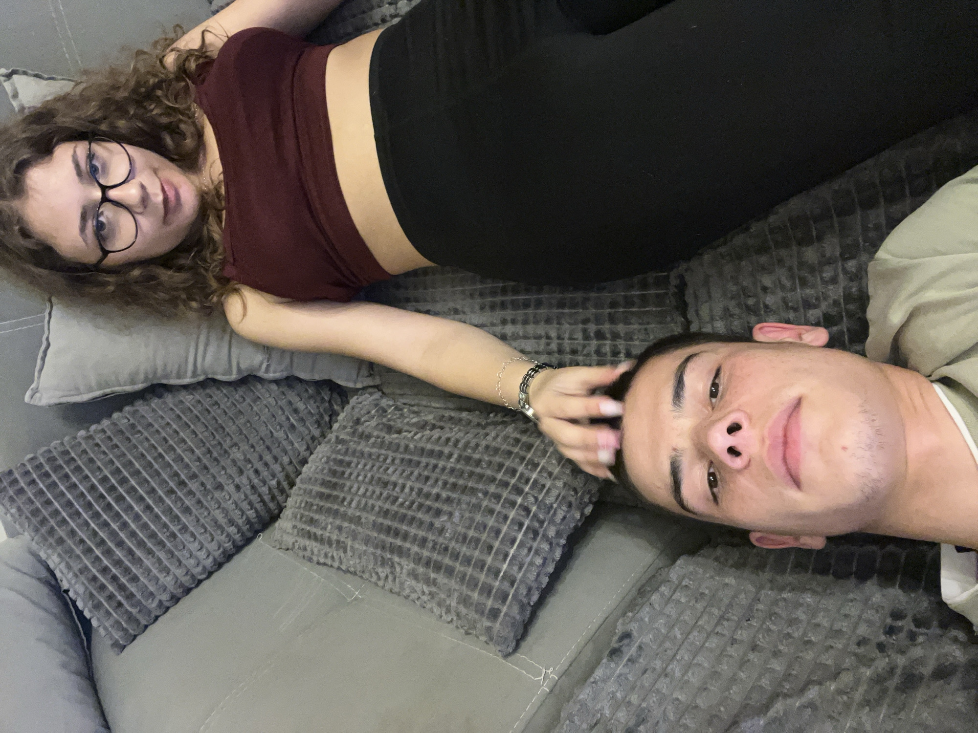 Couple enjoys pizza and TV evening at home in Plovdiv