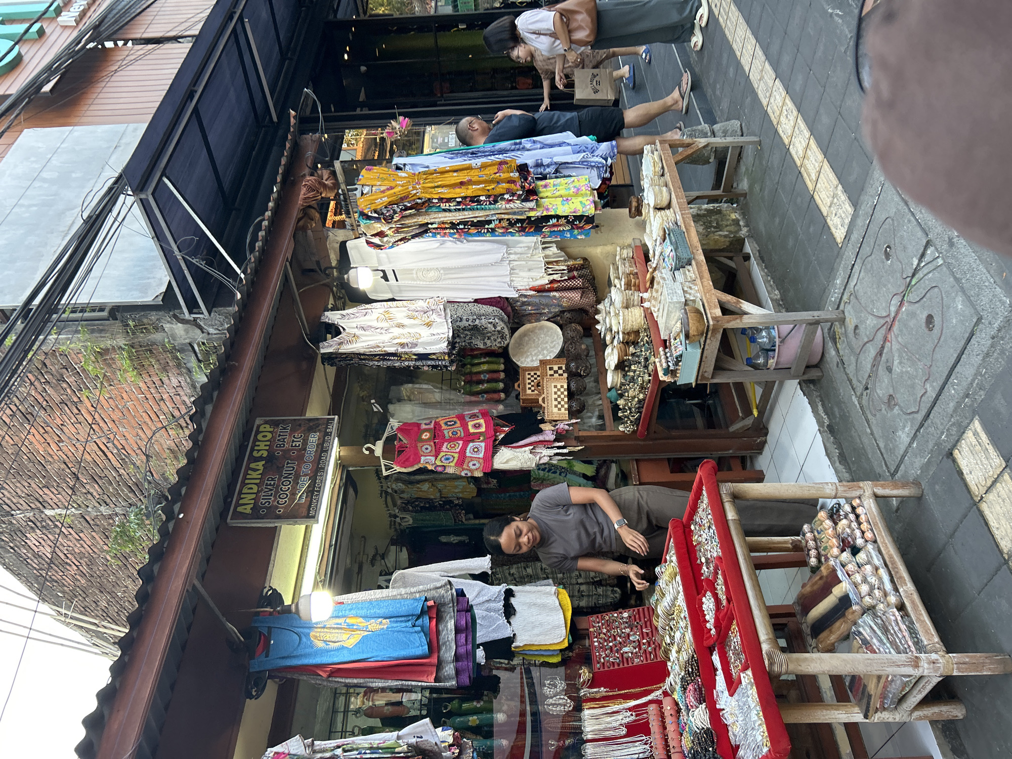 Browsing crystals, books, and gems along Ubud's main strip