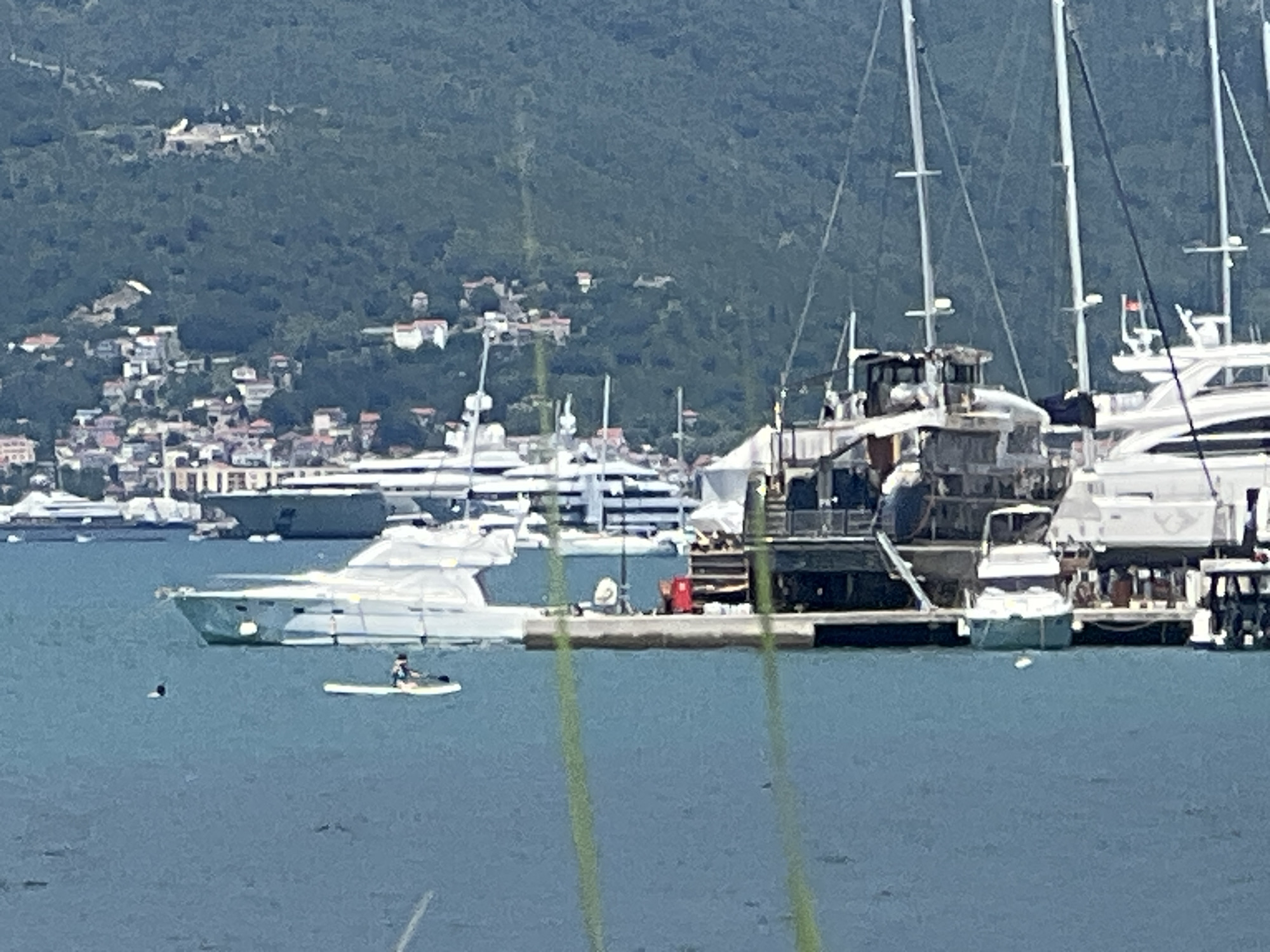 Calm morning on the Bay of Kotor: yachts, campers, and flat water