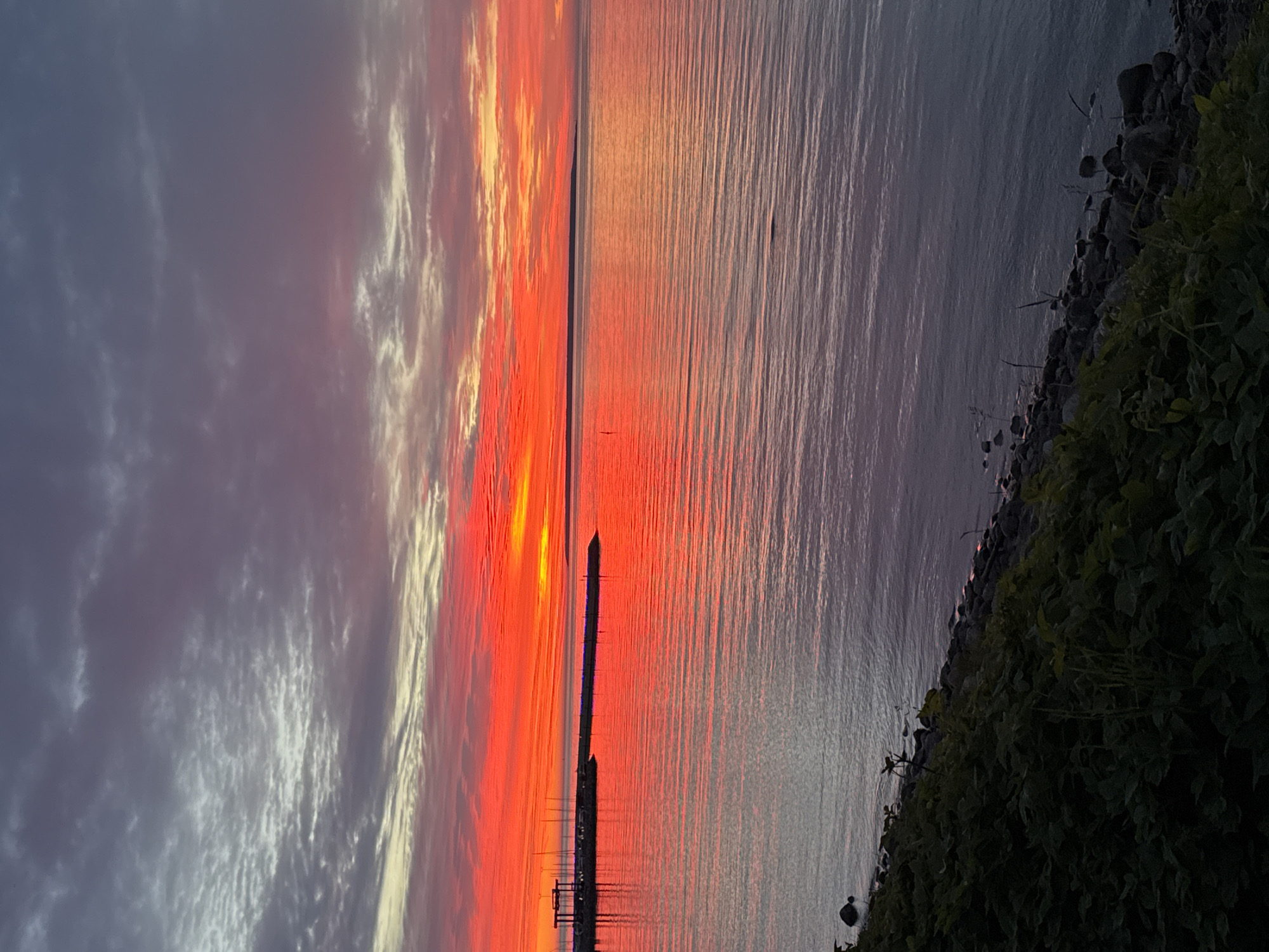Dramatic sunset captivates Tallinn harbor visitors on summer evening