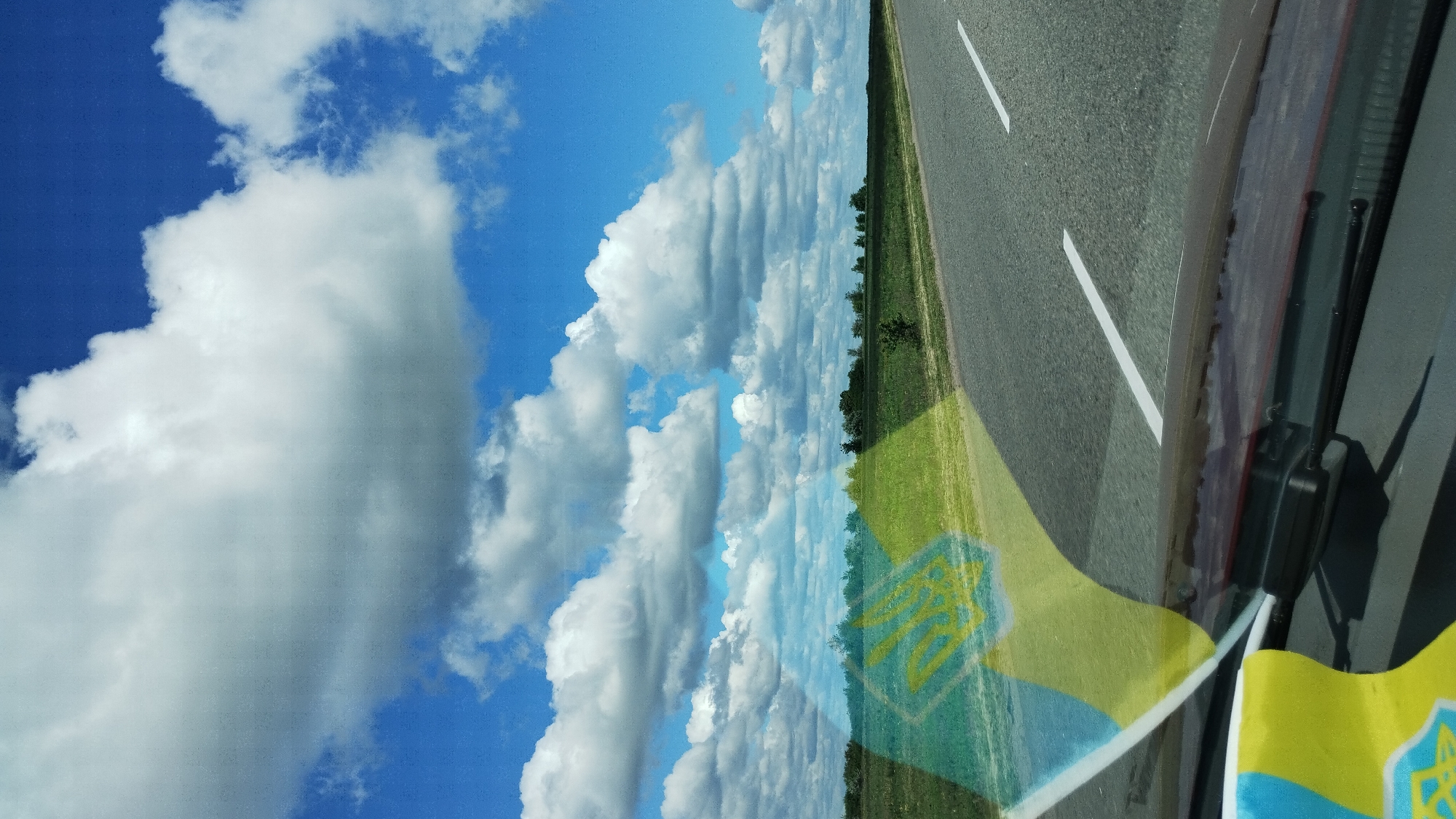 Morning drive through Kropyvnytskyi under cloudy blue skies