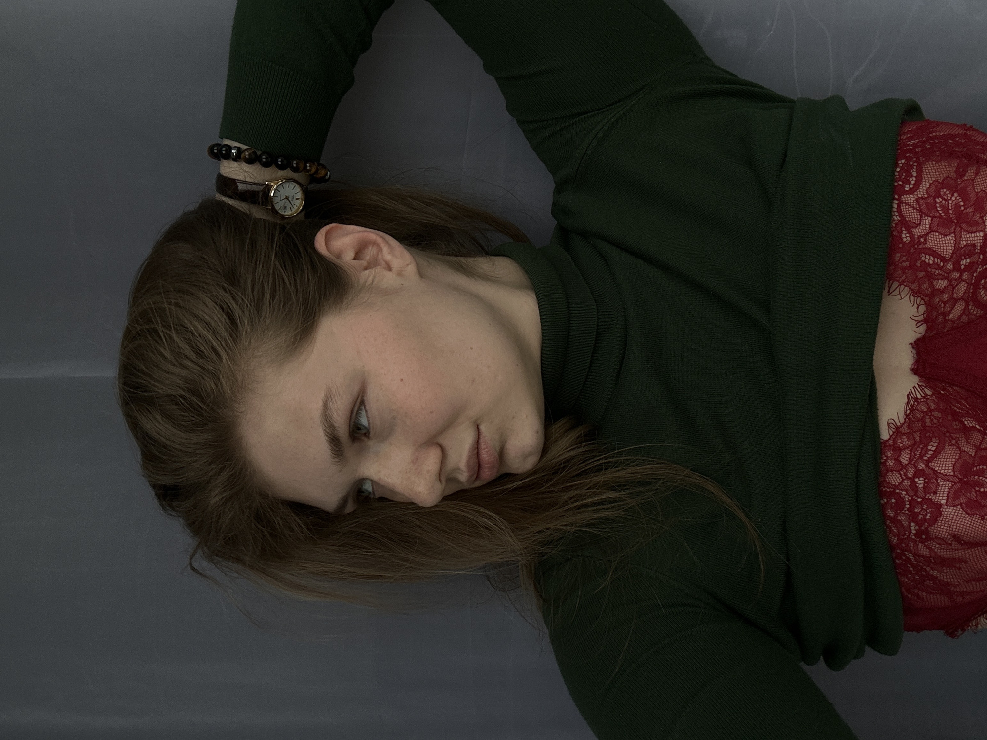 Woman resting indoors captured in casual moment in Kazan
