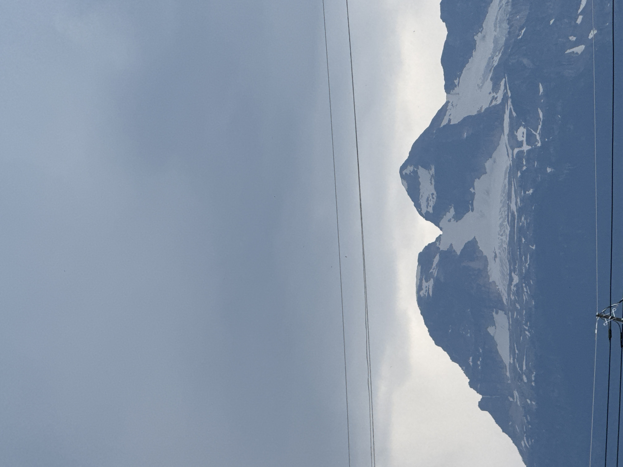 Mount Begbie's snowy peaks under a gray Revelstoke sky