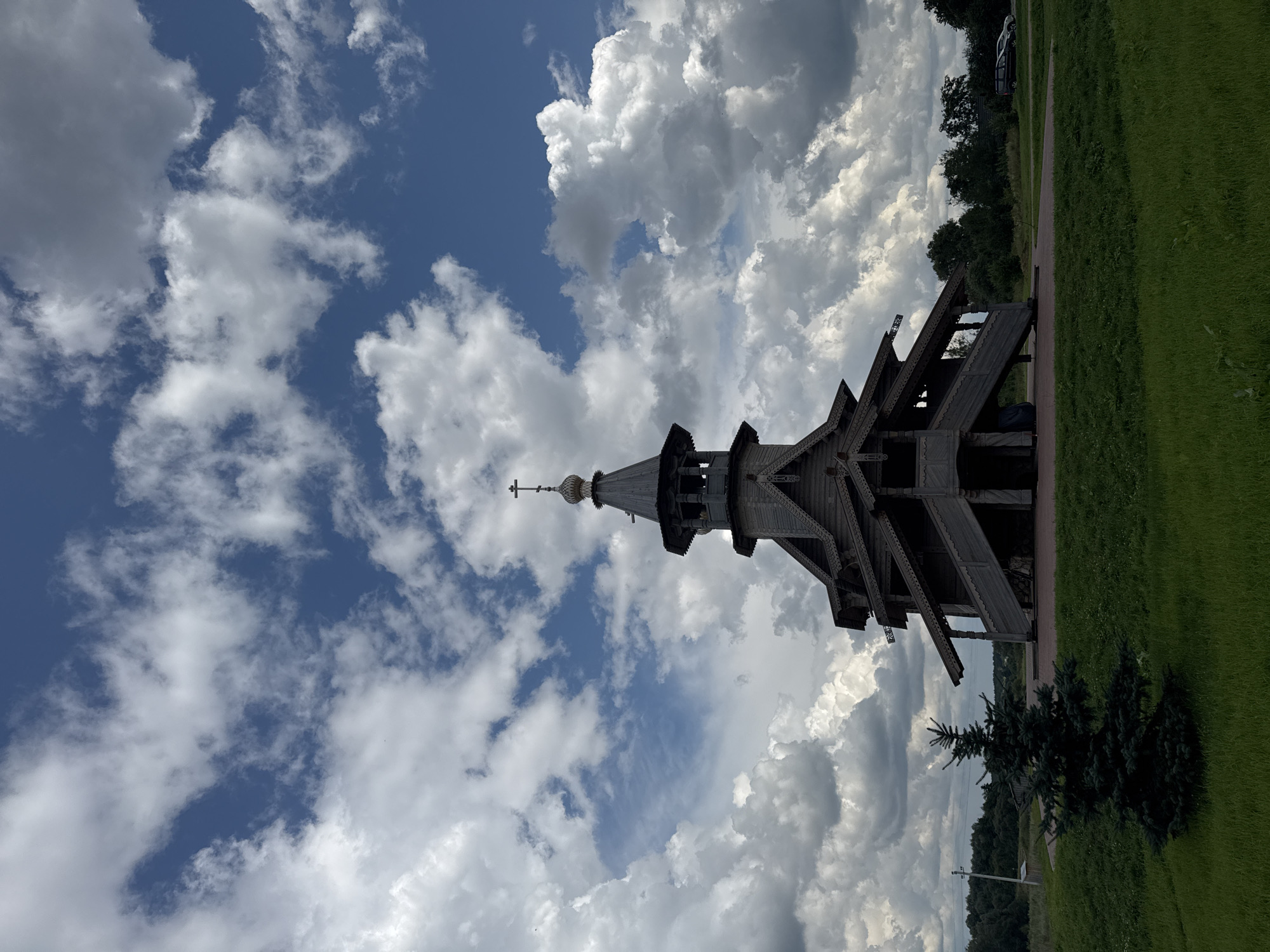 Traditional wooden church and open roads in rural Belarus