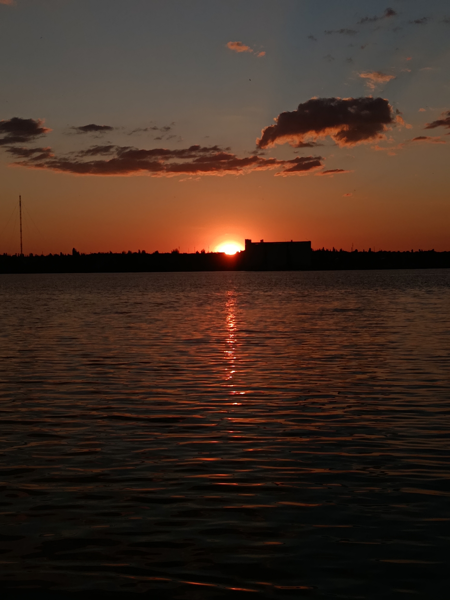 Live music and a waterfront sunset on a summer evening