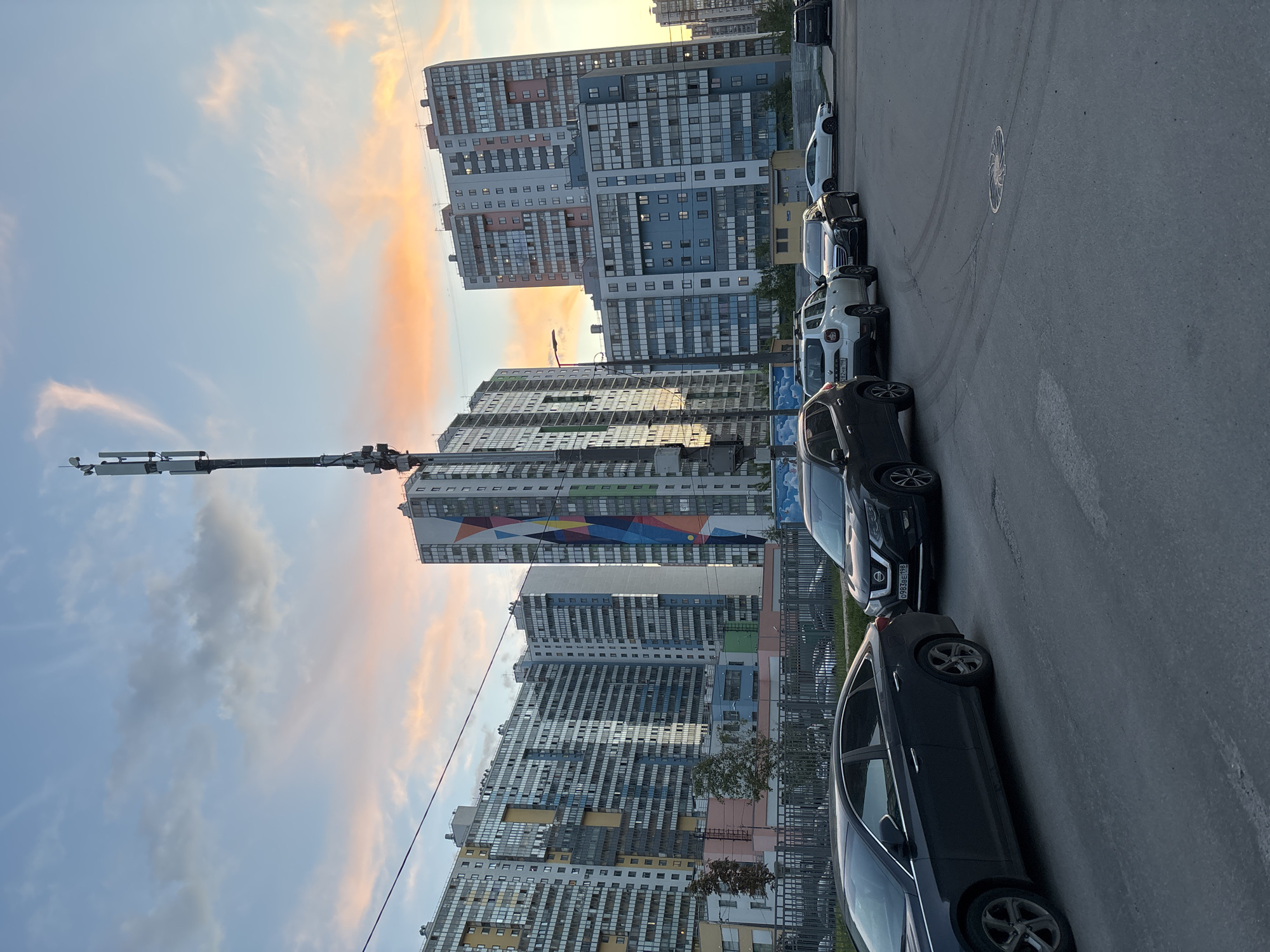 Urban mural featuring female figure documented during sunset