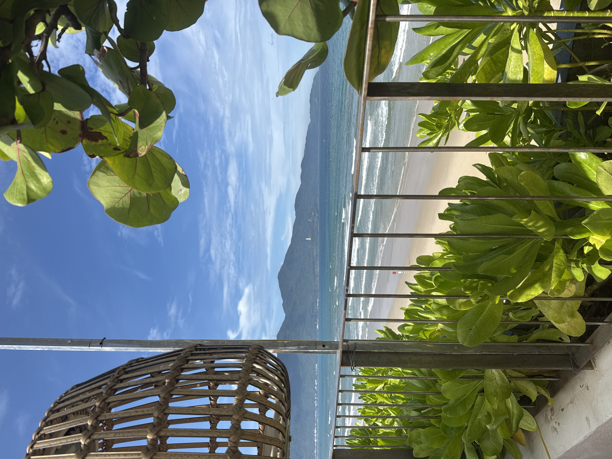 Woman relaxes at beachfront patio in Đà Nẵng, Vietnam