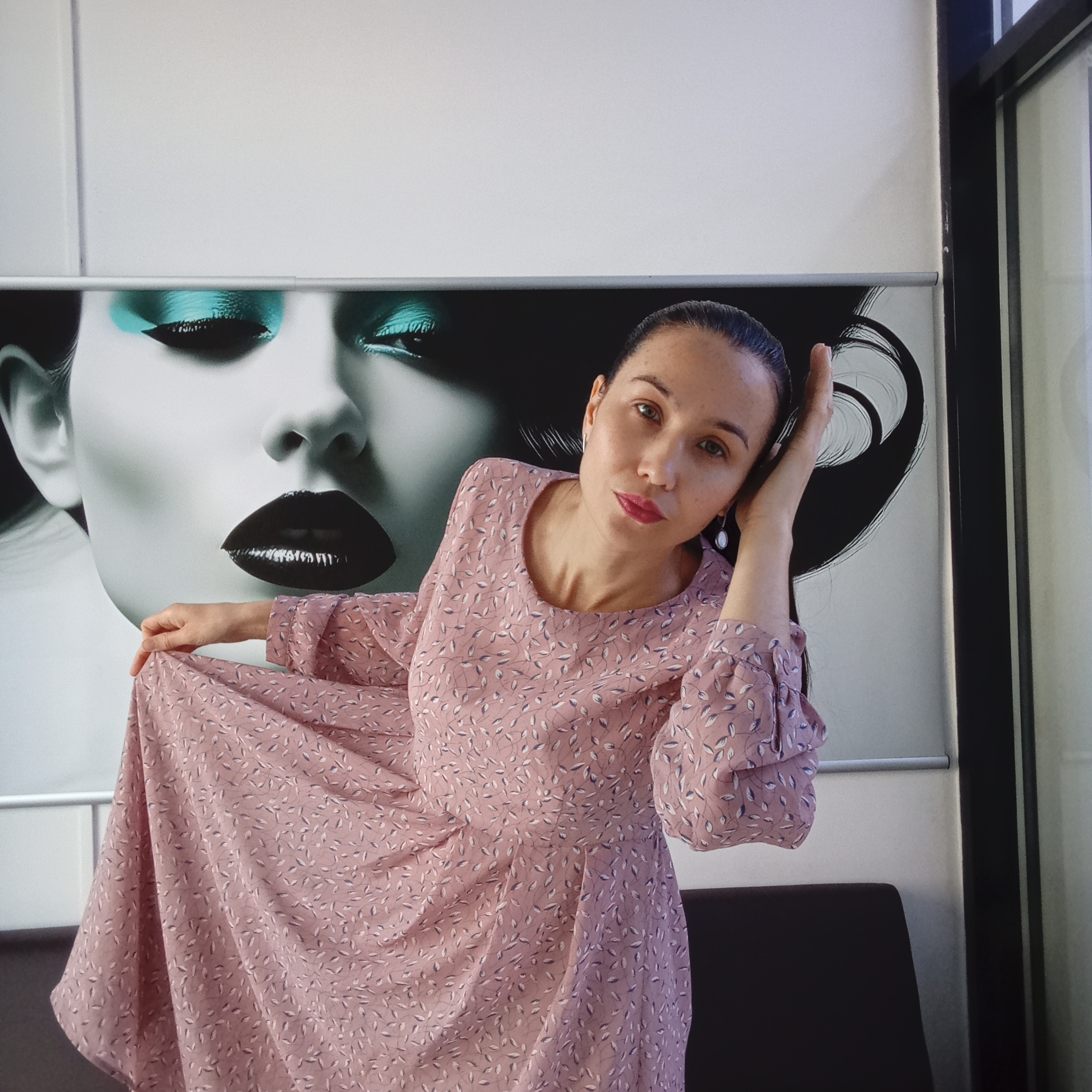 Woman in floral dress photographed indoors in Izhevsk